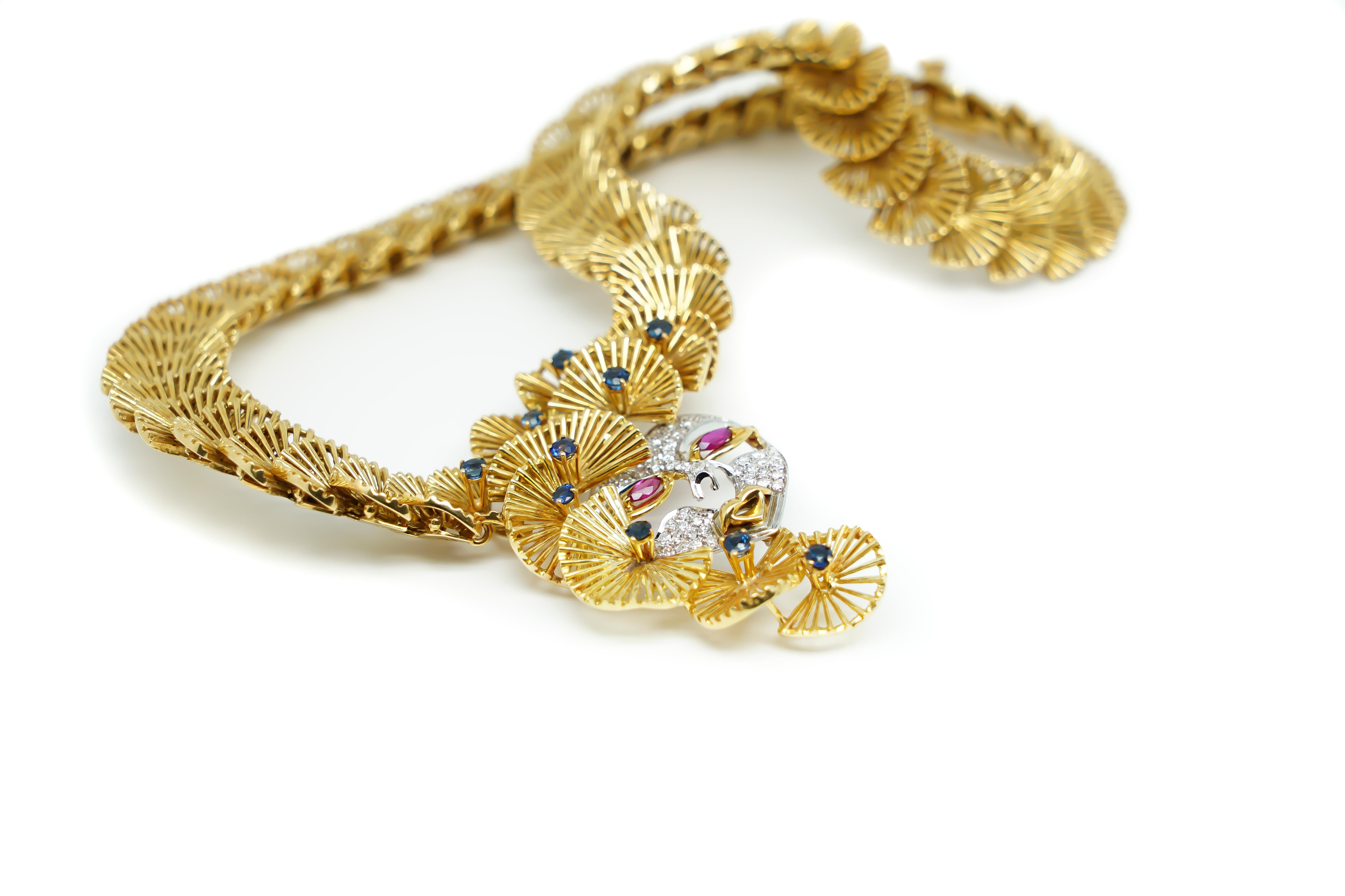 Round Cut Ornamental Necklace 18 Karat Gold, Sapphires and a Mask with Rubies and Diamonds For Sale