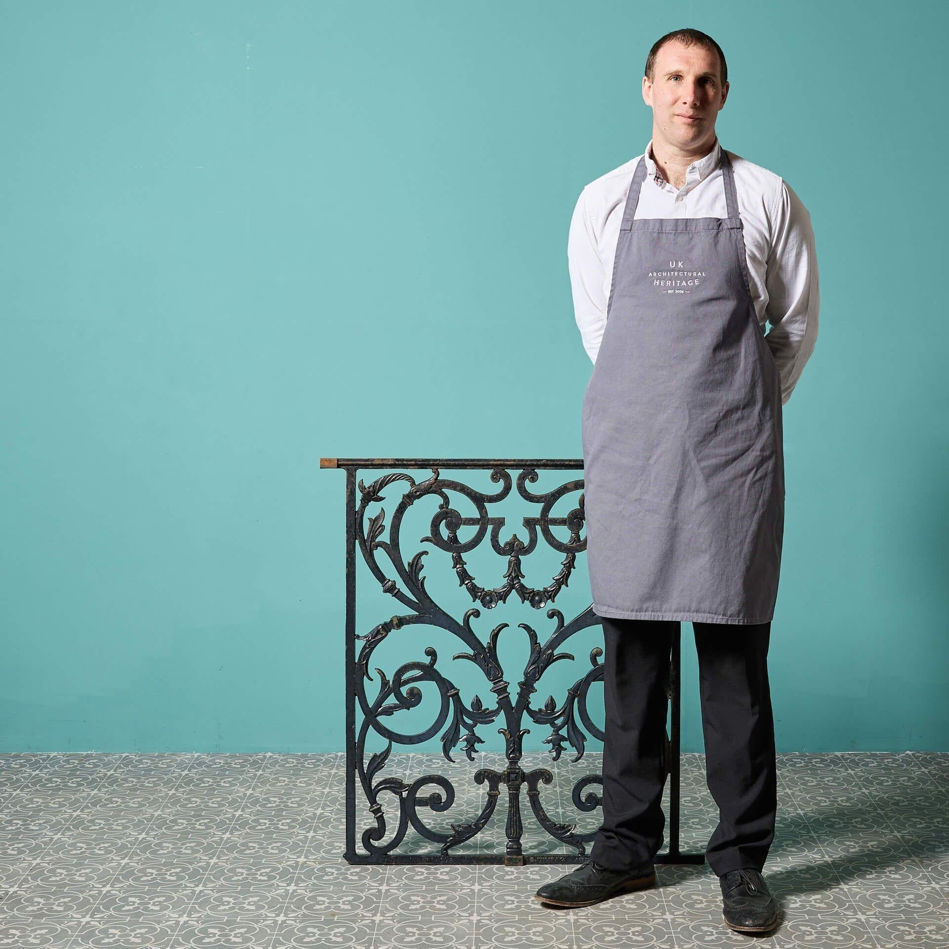 An ornate 19th century English cast iron decorative railing by George Wright & Co, Rotherham (stamped). This is one of various similar panels we have available for sale, each usable as individual decorative panels or together as a balcony or