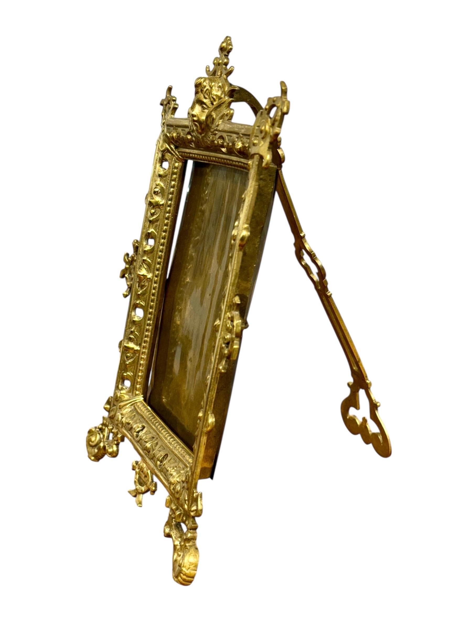 Ornate 19th-Century Gilt Bronze Tabletop Frame with Cherub Motif For Sale 1