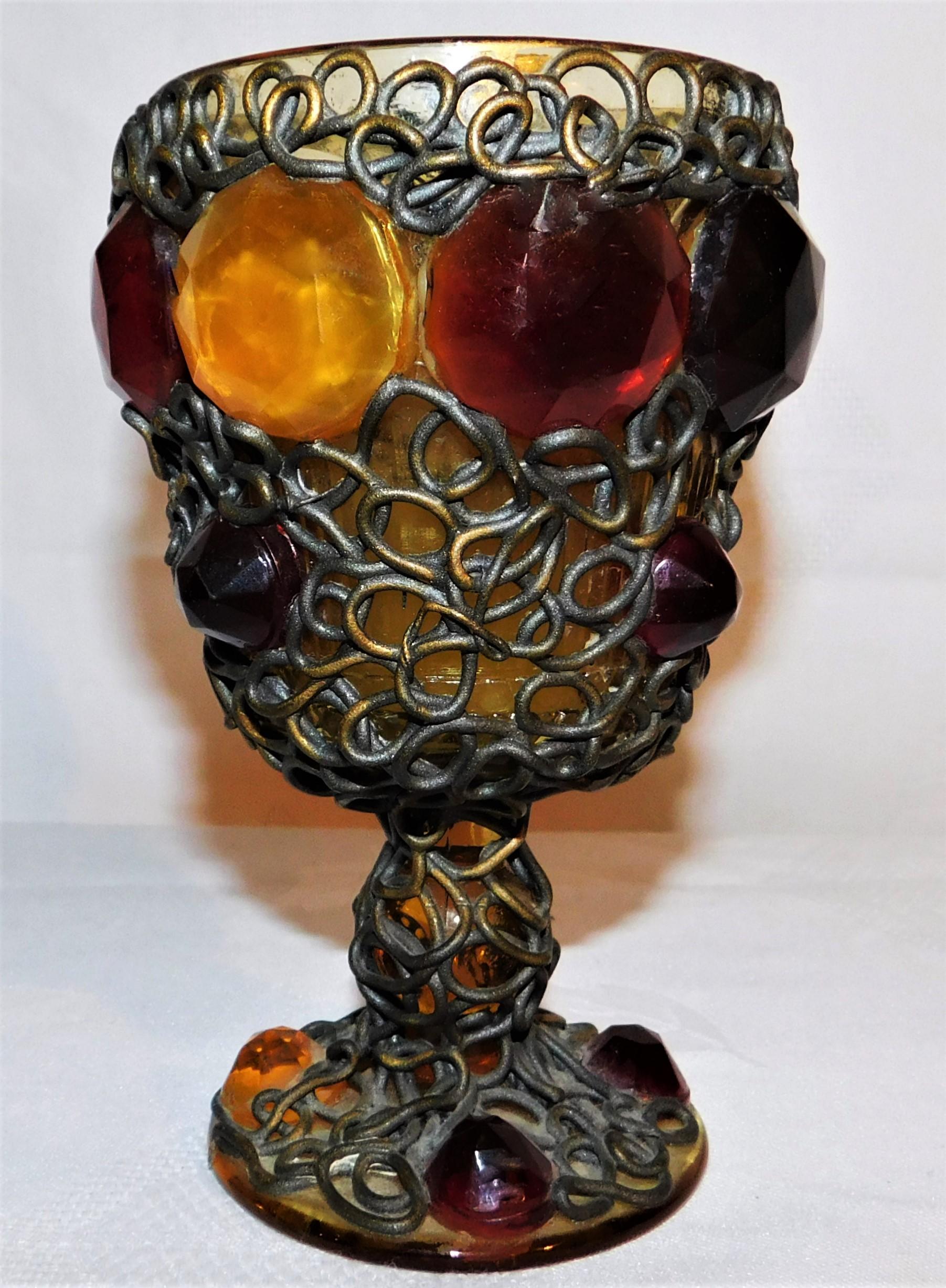 Beautiful ornate 19th century jeweled chalice embedded in brass wire on colored glass. A very unique drinking vessel.