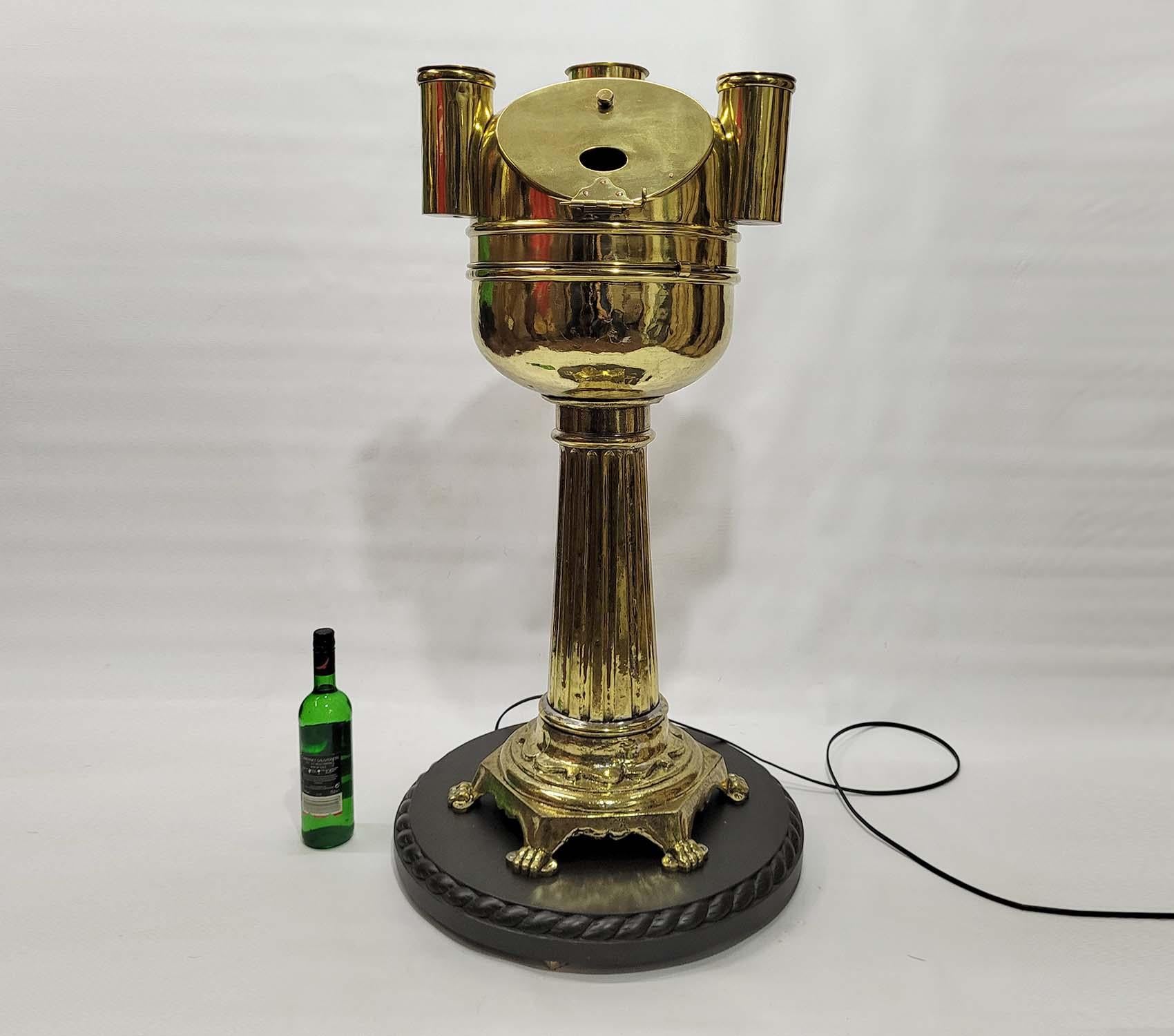 Turn of the century solid brass yacht binnacle. Pedestal base design with great detail on the graduated column and flange footed base. The hood has a hinged door with viewing port. The bowl holds a gimballed compass from American maker Kelvin and
