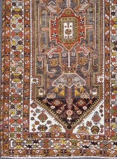 Antique Persian Bakhtiar Gallery Rug Featuring a Multi-Medallion Tribal Design