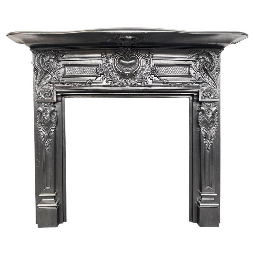 Ornate antique late Victorian cast iron fireplace surround For Sale