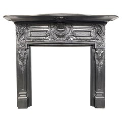 Ornate antique late Victorian cast iron fireplace surround