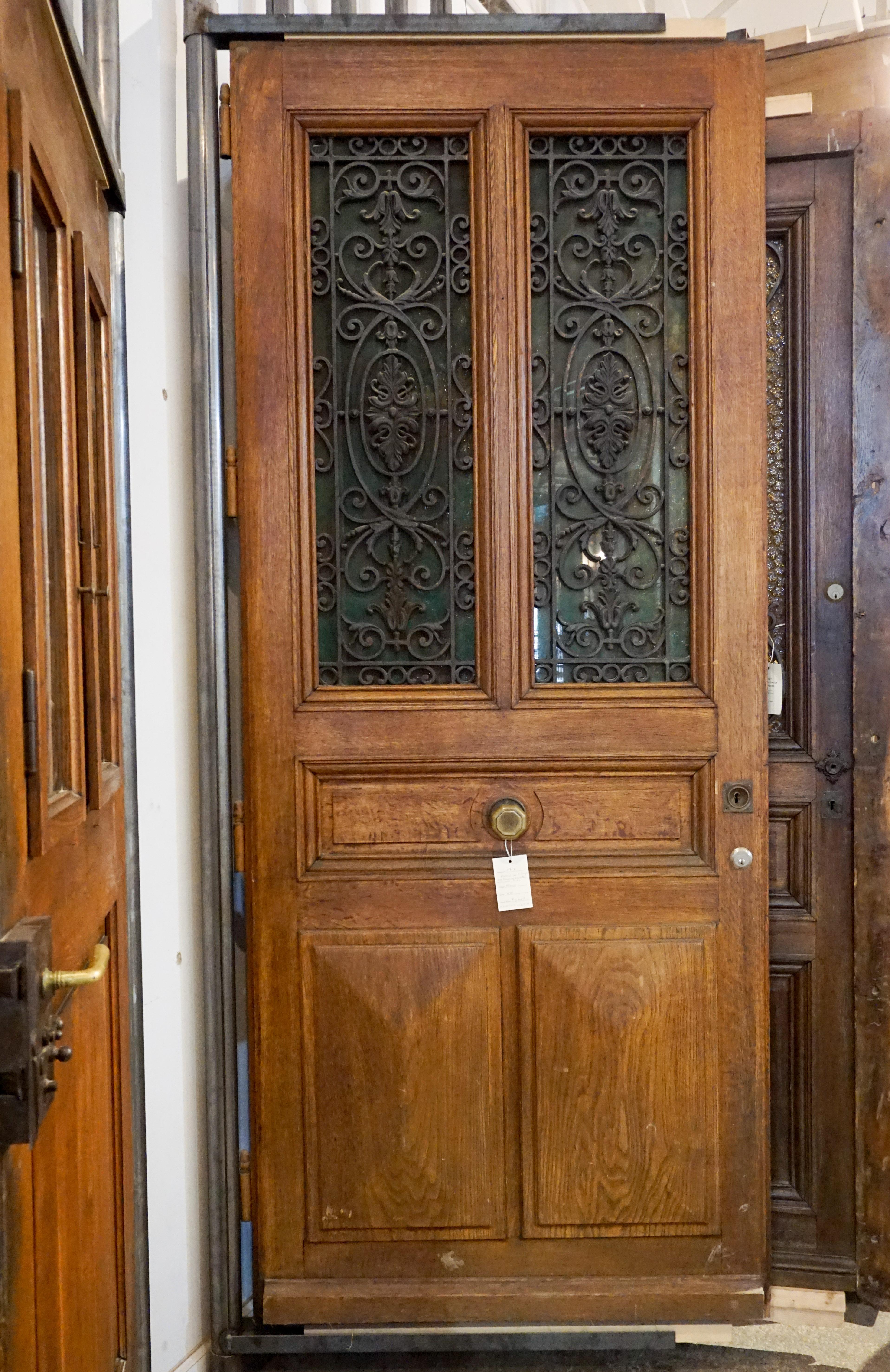 Here we have a beautiful antique oak entry door from France. Beautiful cast iron panels and center knob enhance this exquisite European door, circa 1880.

Measurements are: 41.25 x 102.5.