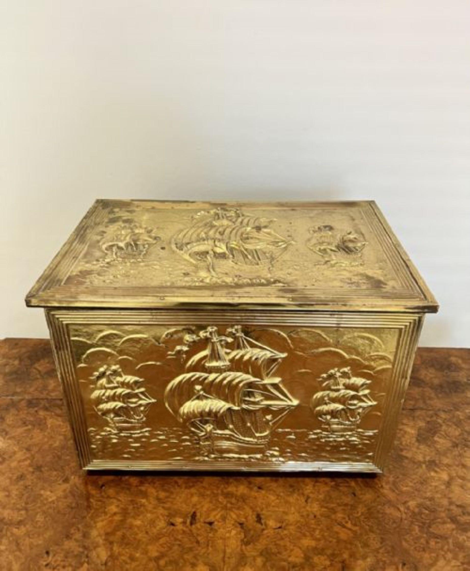 Ornate antique quality brass coal box having a quality ornate brass lift up lid with ships and sea opening to reveal a storage compartment for coal with ornate front and sides. 