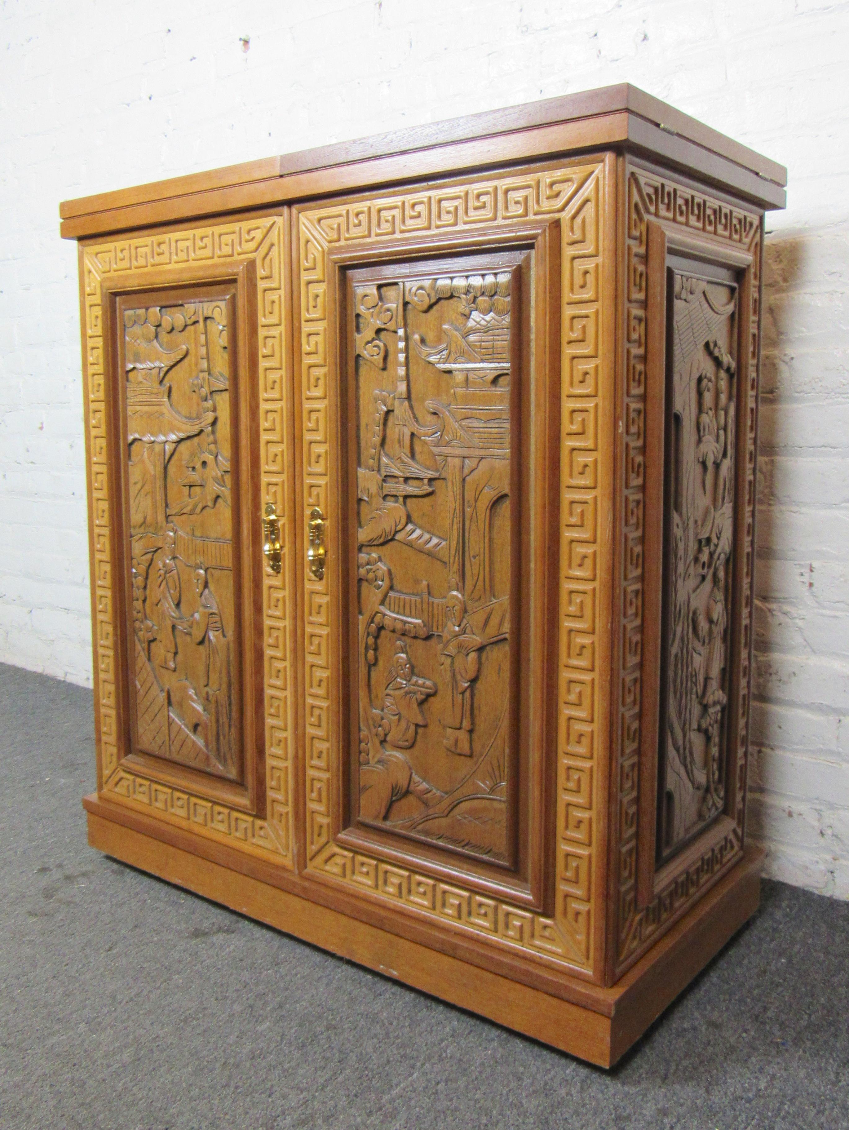 Vintage fold out dry bar with beautifully sculpted sides and front. Fold down top with marble inserts, ample storage for a variety of bar items. Set on wheels for easy mobility. Width: 36-72