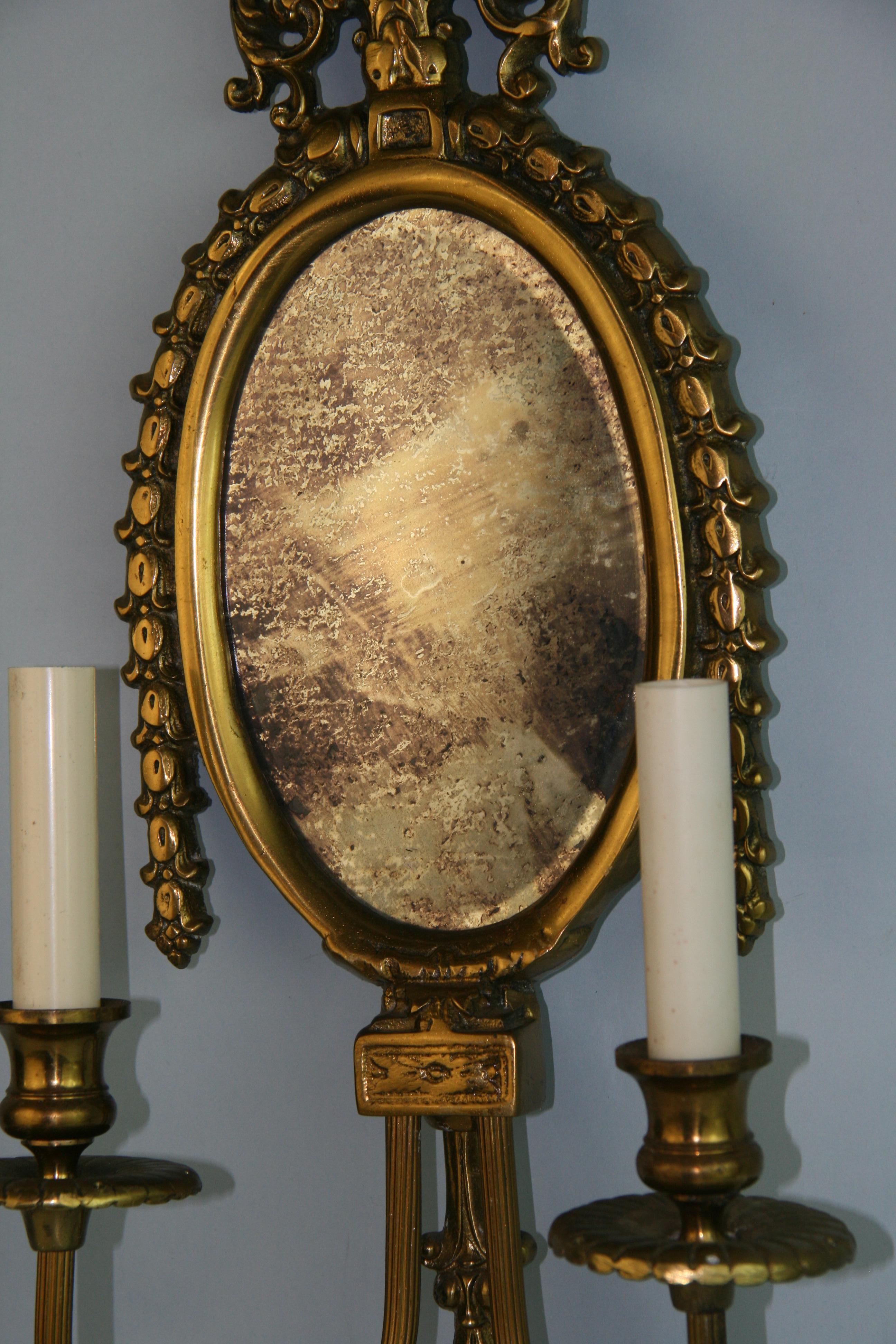 Ornate Brass Two Arm Mirrored Candle Sconces, Pair In Good Condition For Sale In Douglas Manor, NY
