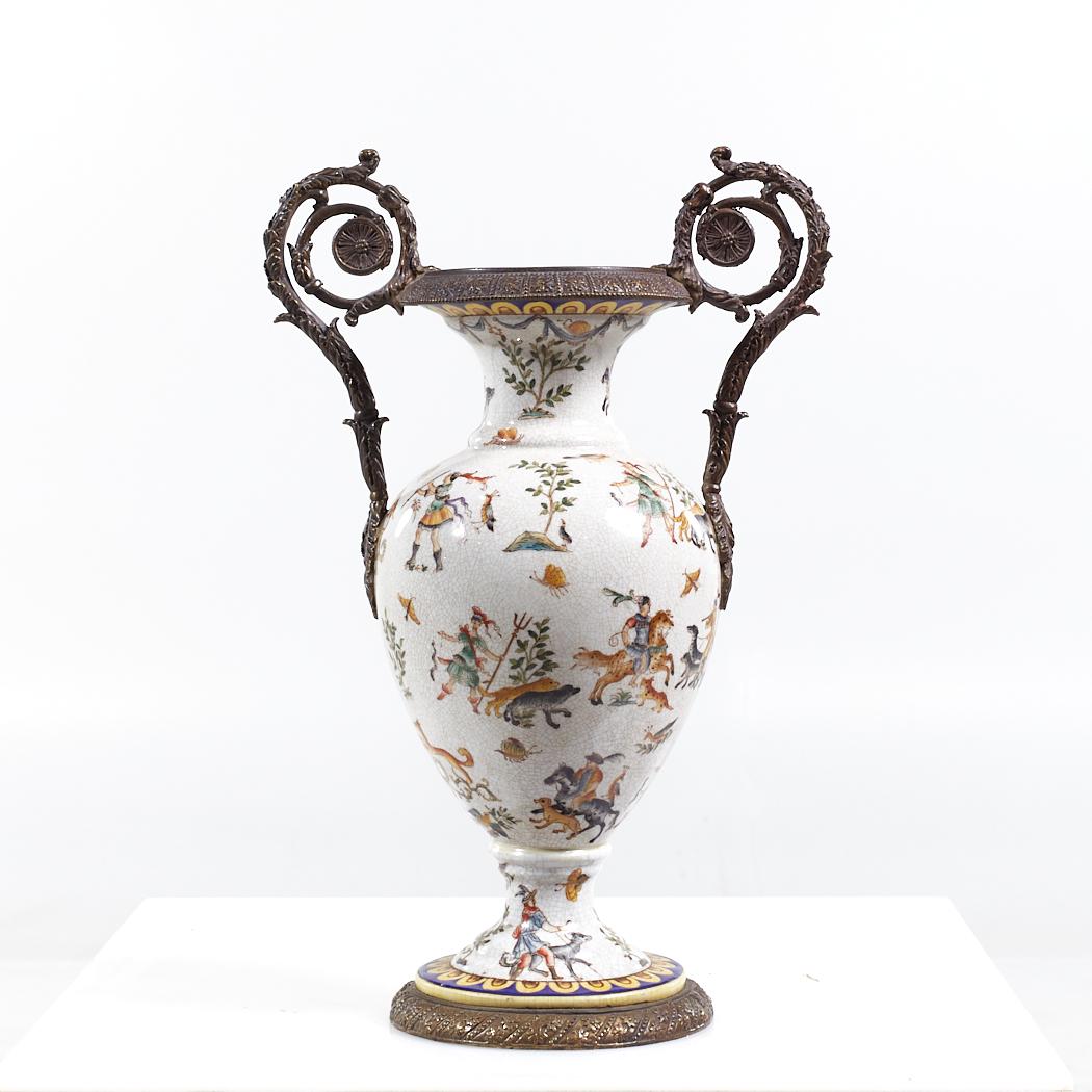 Ornate Bronze and Ceramic White Vase

This vase measures: 11.5 wide x 8 deep x 17.75 inches high

We take our photos in a controlled lighting studio to show as much detail as possible. We do not Photoshop out blemishes.

Most of our decor items ship