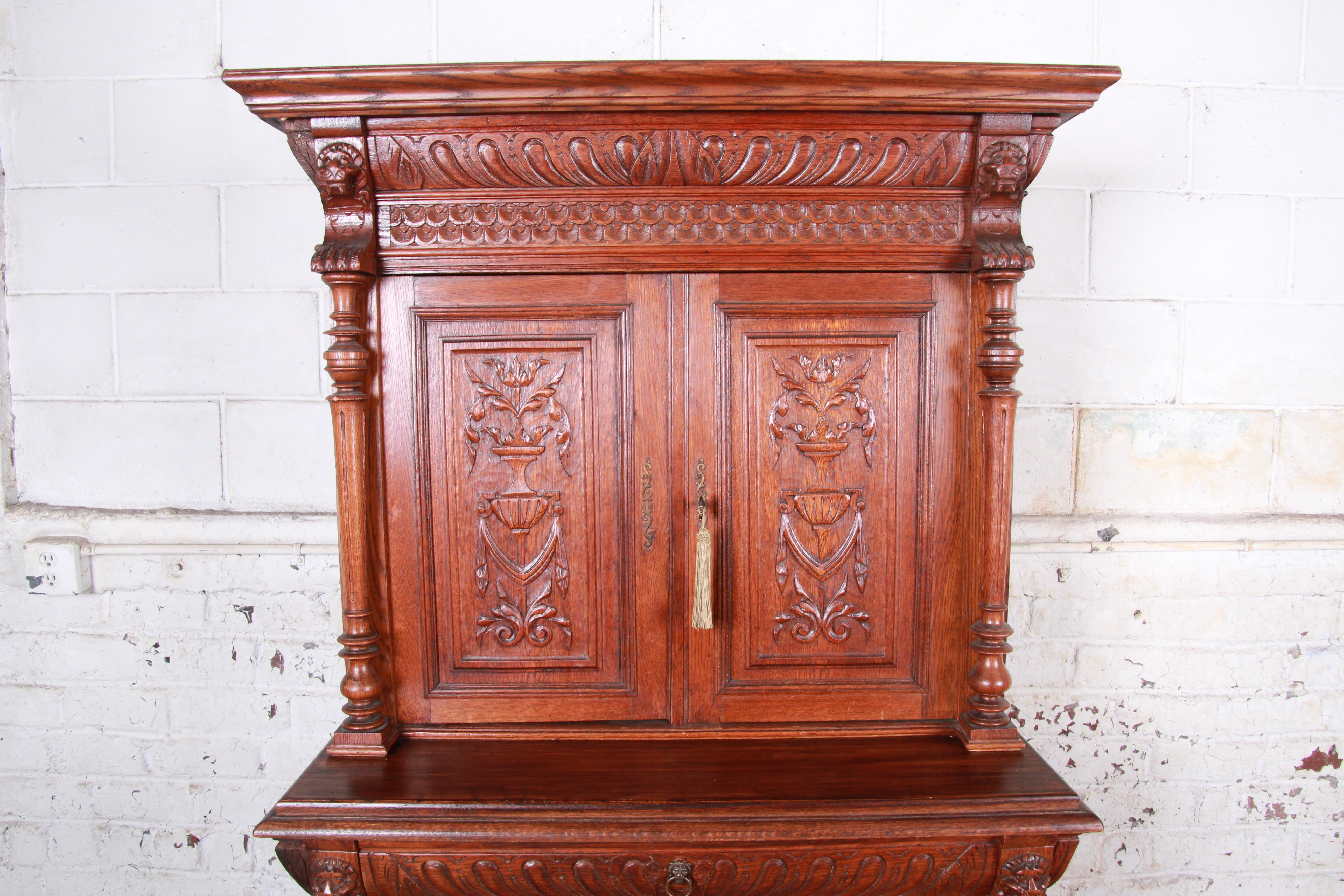 20th Century Ornate Carved Oak French Sideboard Bar Cabinet with Lion Figures, circa 1900