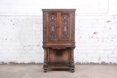 Ornate Carved Walnut Bar Cabinet, circa 1920s