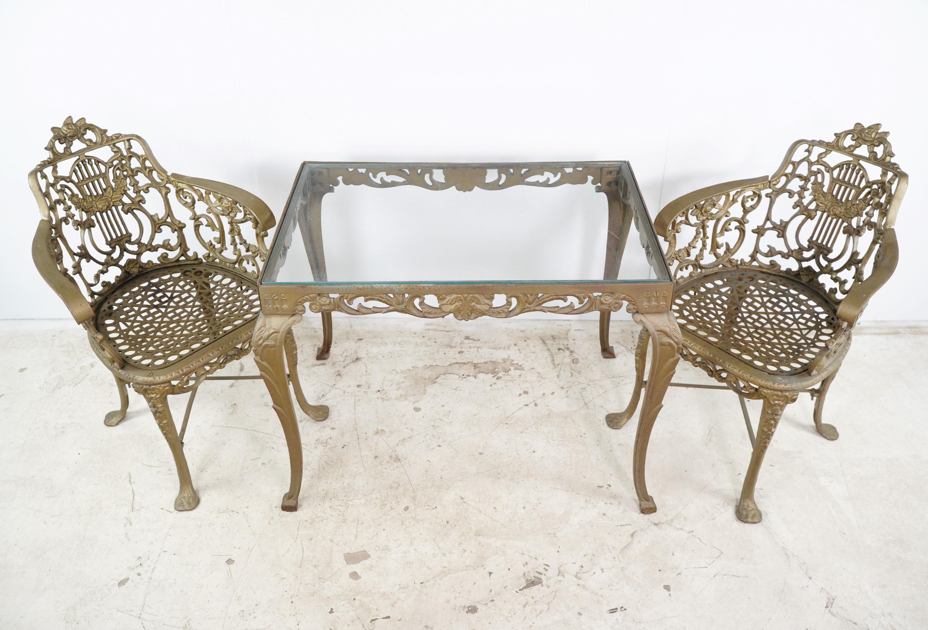 This heavy cast iron antique garden furniture set exudes timeless charm and durability, adding a touch of elegance to outdoor spaces. The table and chair set is made of old heavy cast iron with no breaks. The table glass has scratches, but