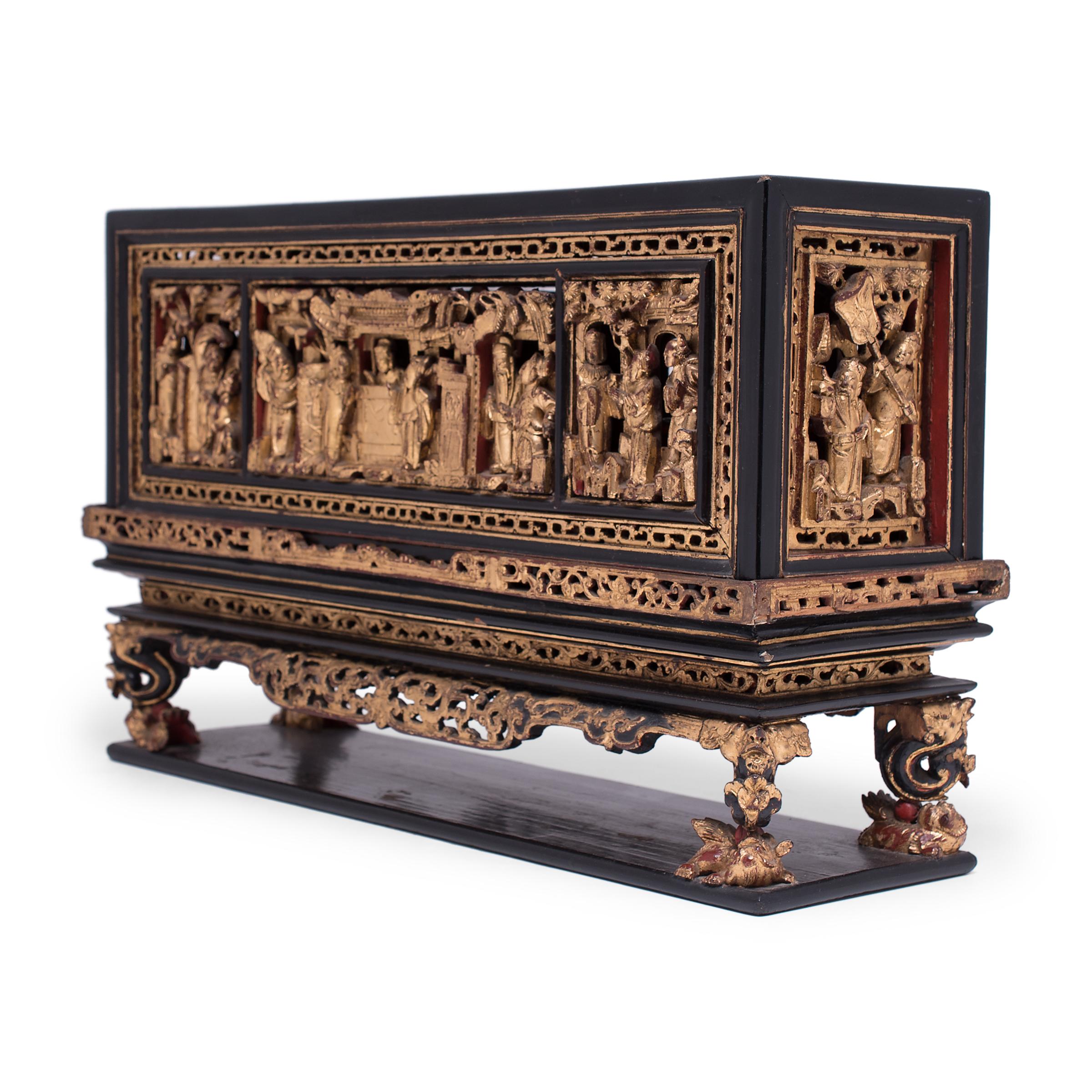 This dazzling display of intricate carvings and gilt lacquer is a 19th-century box used for dispersing smoke from burning incense. Incense made from dried aromatic plants and essential oils would be burned within the home to cleanse interiors and