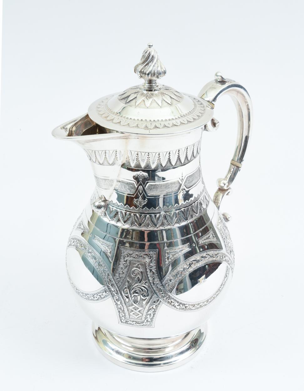 English silver plate tea or coffee pot with exterior design details. The tea or coffee pot is in excellent condition, minor wear consistent with use / age. The pot stand about 11 inches high x 9 inches diameter.