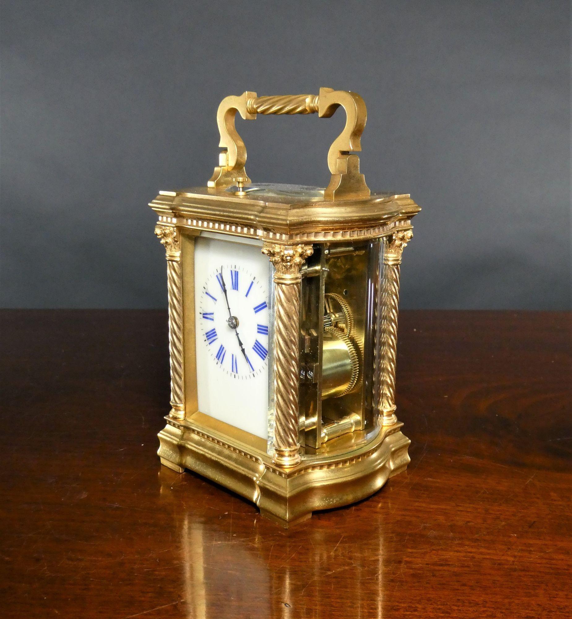 Ornate French Gilded Repeating Carriage Clock
 
Ornate French gilded carriage clock housed in a decorative case with curved side panels.  Barley twist columns with Corinthian capitals and decorative moulding to the top and bottom of the case ion all