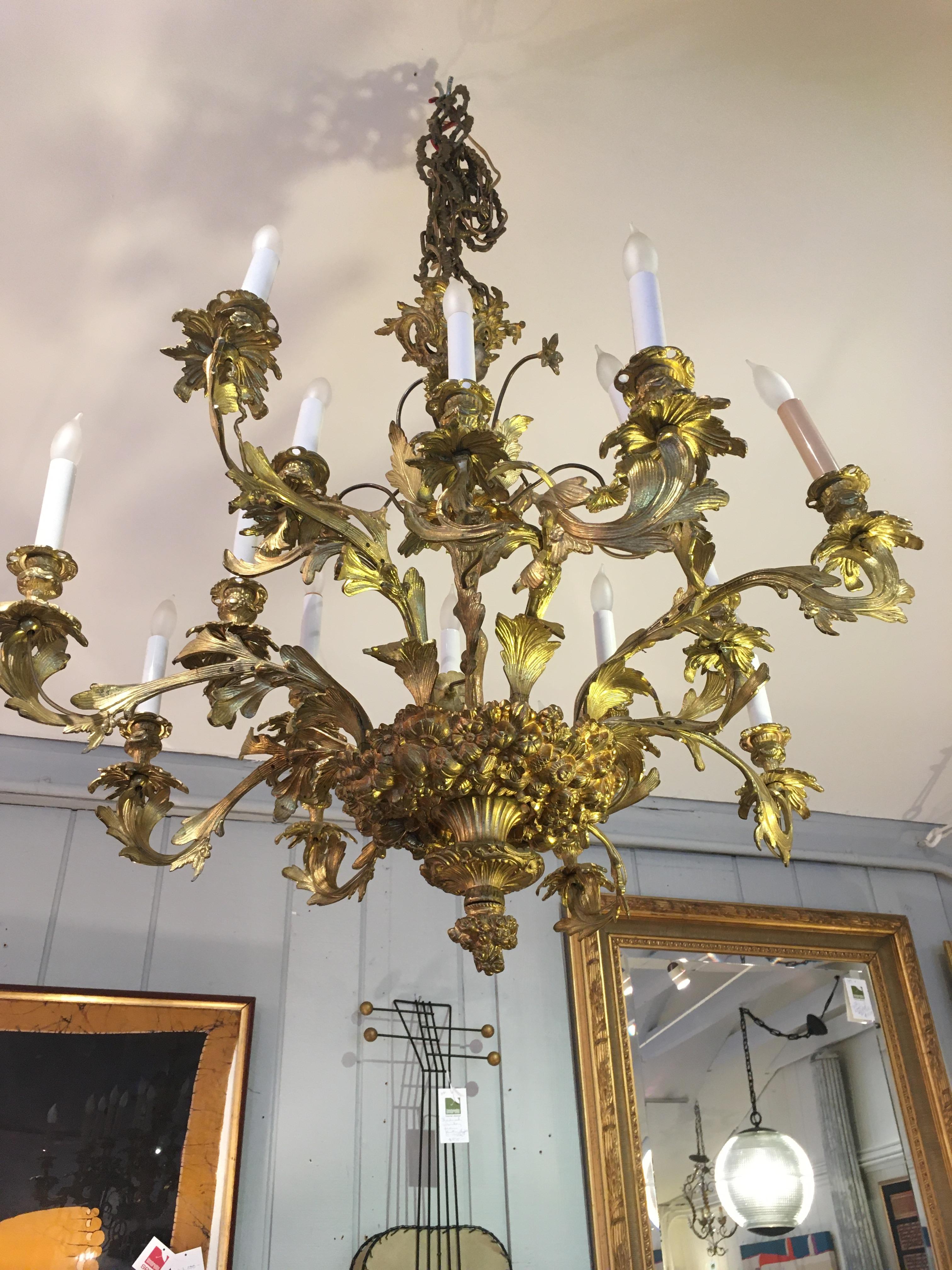 Ornate French Rococo Style Relief Cast Gilt Bronze 16-Light Chandelier In Good Condition In Hopewell, NJ