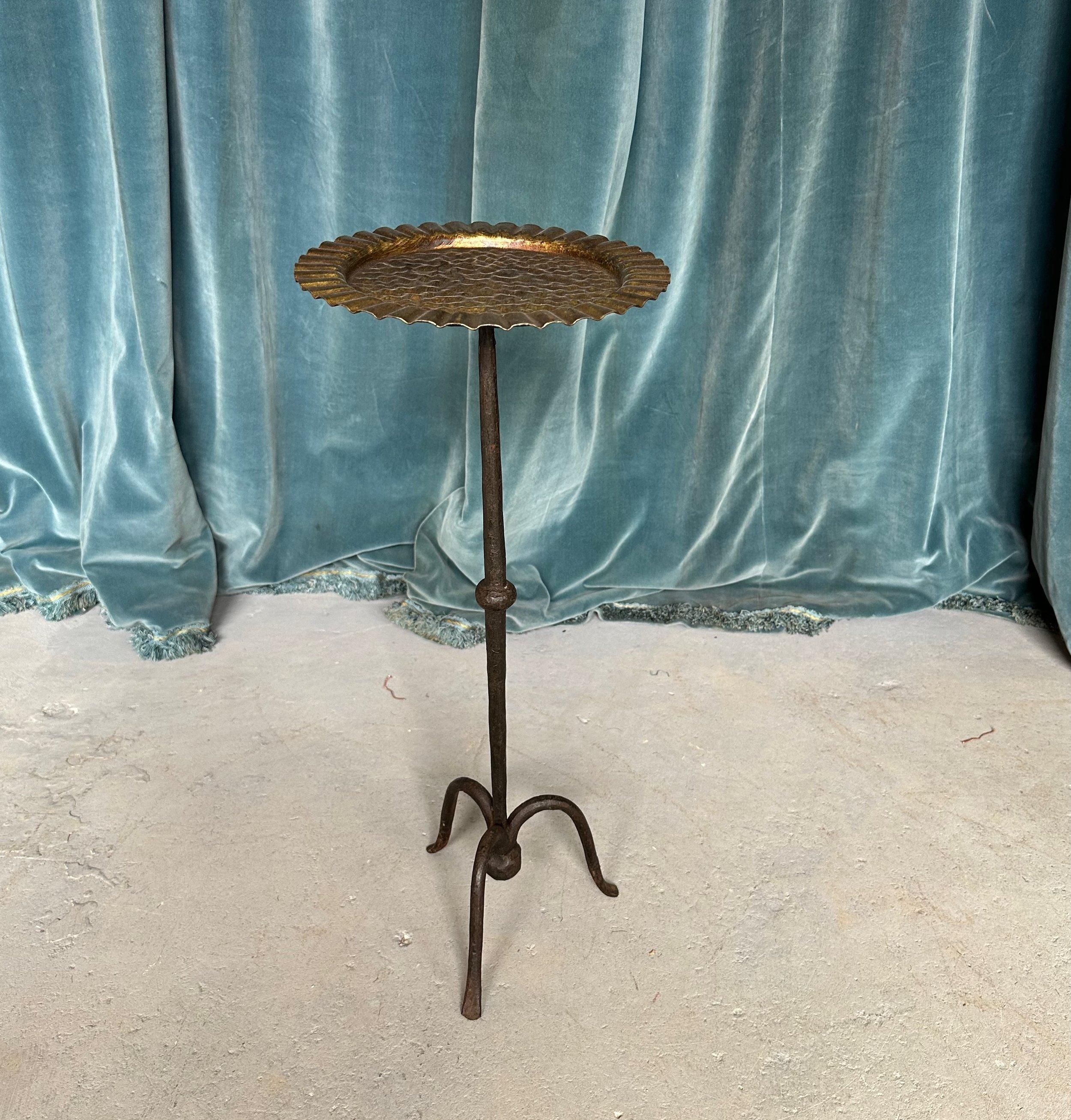 This ornate and unusual Spanish gilt metal side or drinks table was recently handcrafted by skilled artisans using conventional iron-working techniques with an emphasis on superior quality. Each curve and detail on the table signifies the touch of a