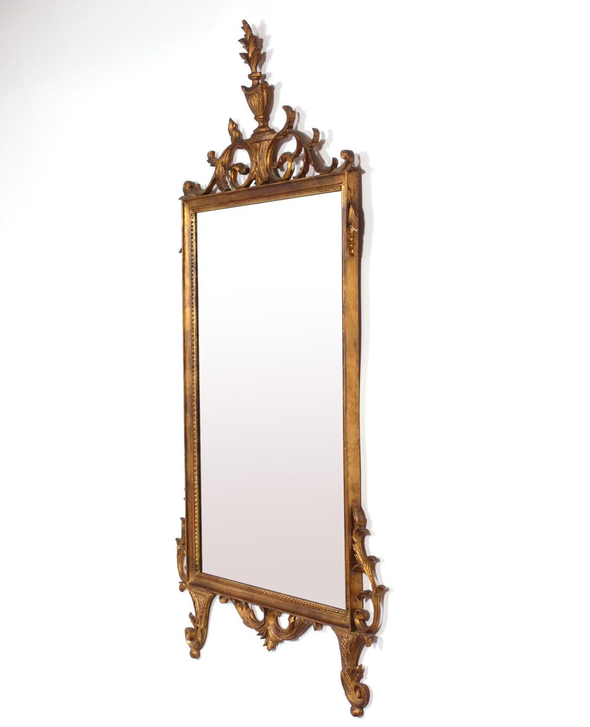 Ornate gilt mirror, Italian, circa 1950s. Retains warm original patina to both the gilt wood frame and the original mirrored glass.