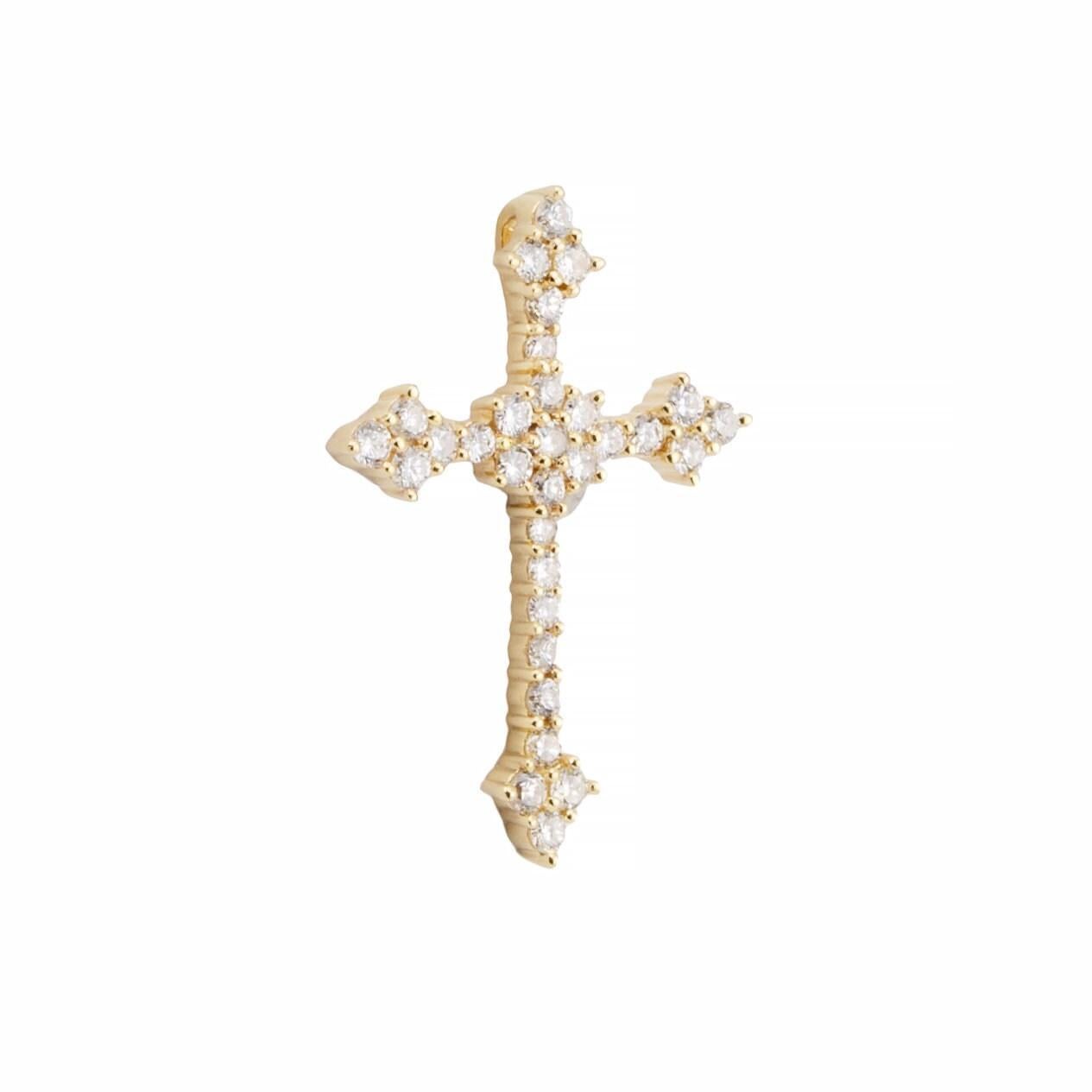 Aston Estate Jewelry présente

Croix de style gothique en or jaune 14 carats, sertie de diamants pavés. Serti de 31 diamants d'un poids total de 0,90 carat. De couleur G et de pureté SI, les diamants sont fixés par des griffes partagées.

Le