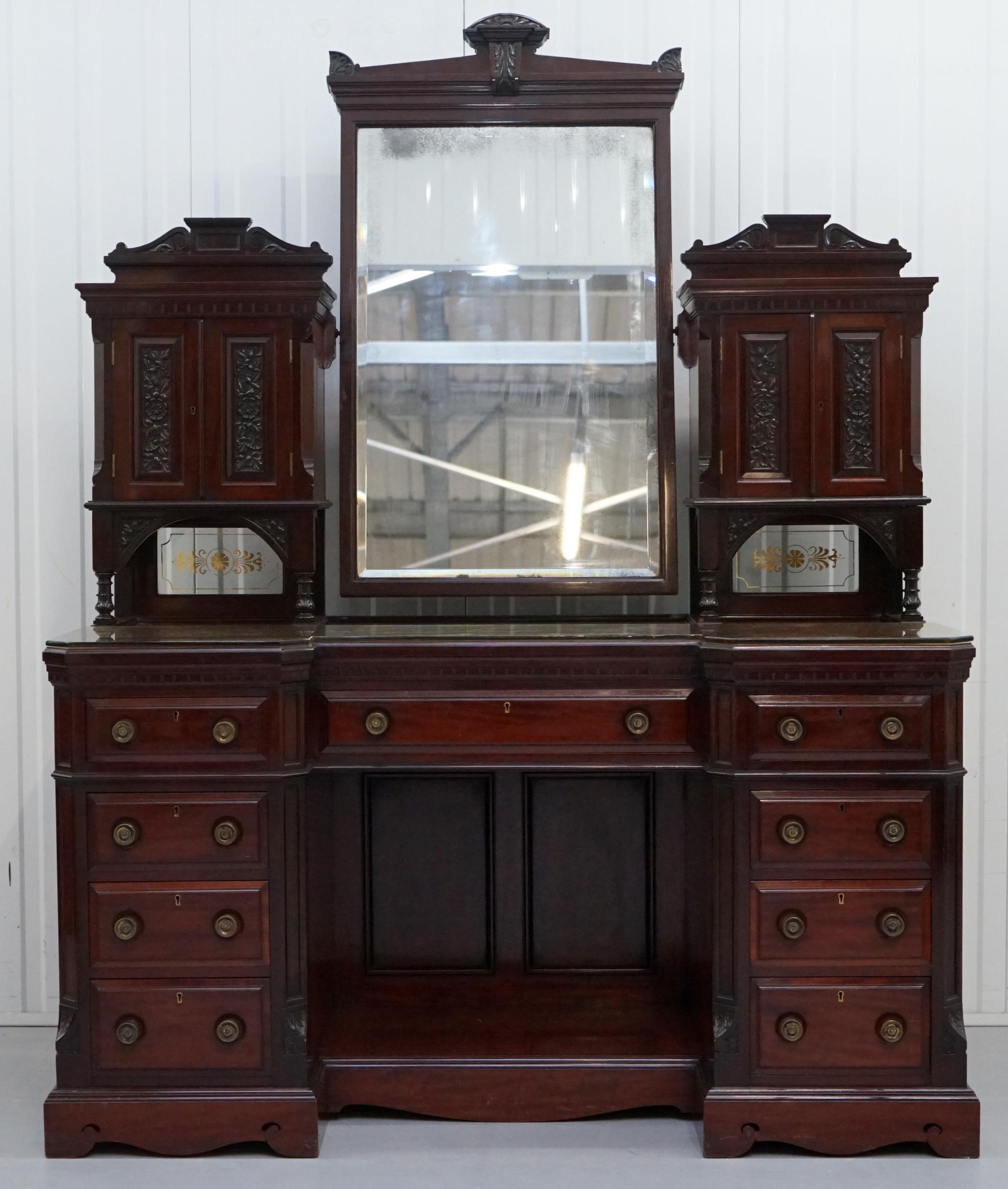 We are delighted to offer for sale this stunning large and very grand Victorian mahogany dressing table

A good looking and substantial piece of furniture, all original with period etched glass to the bottom back panels, the mirror is Victorian