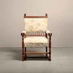 Ornate, hand-carved armchair with lion motifs from the late 19th century, Europe