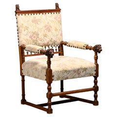 Ornate, hand-carved armchair with lion motifs from the late 19th century, Europe