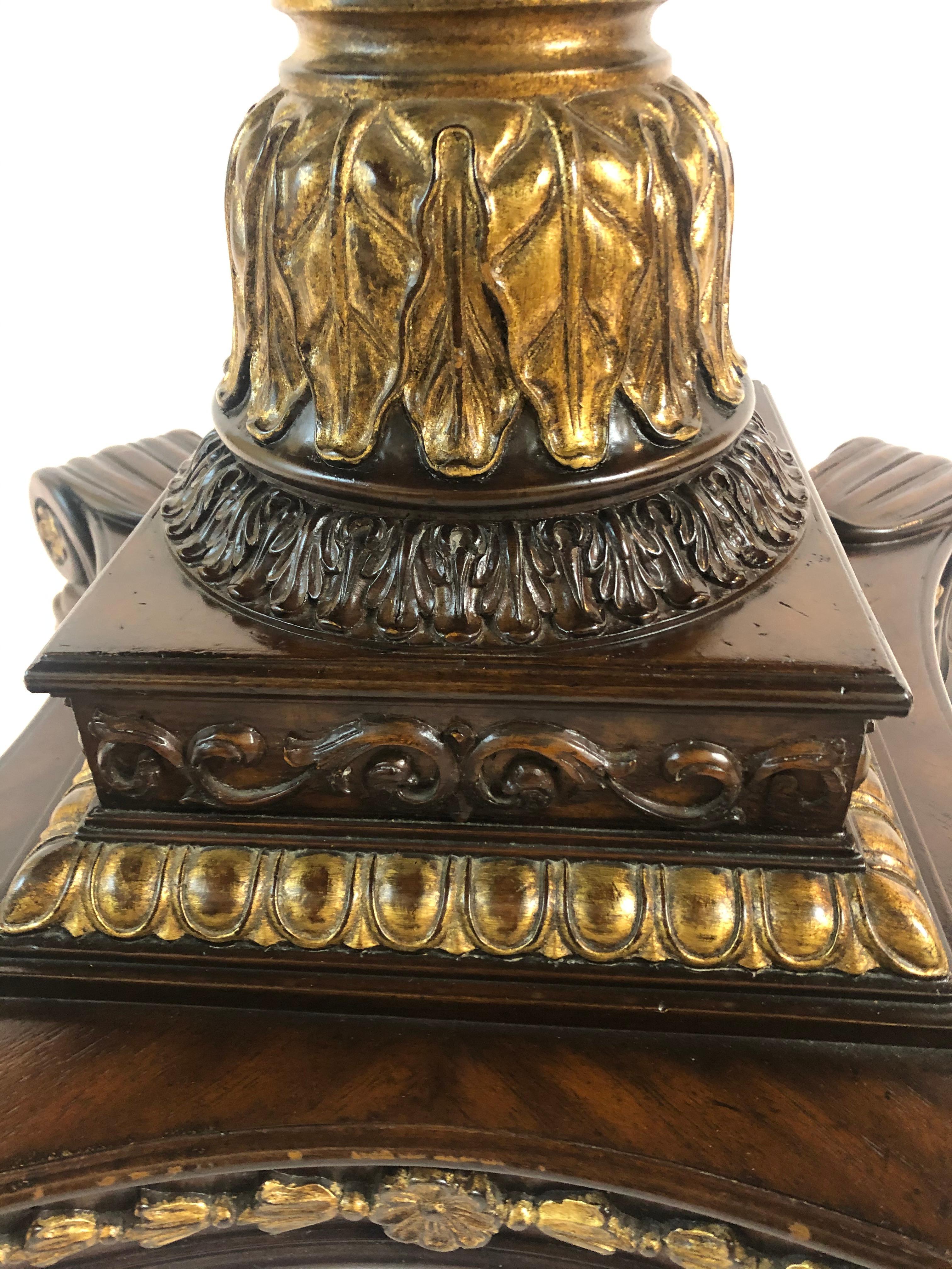 Sublime round center table having ornate mixed wood inlaid top and fancy carved wood and gilded pedestal on impressive base with four handsome paw feet. A lovely gilded edge is on the periphery of the table.
Apron 28.75 H
Top comes off for