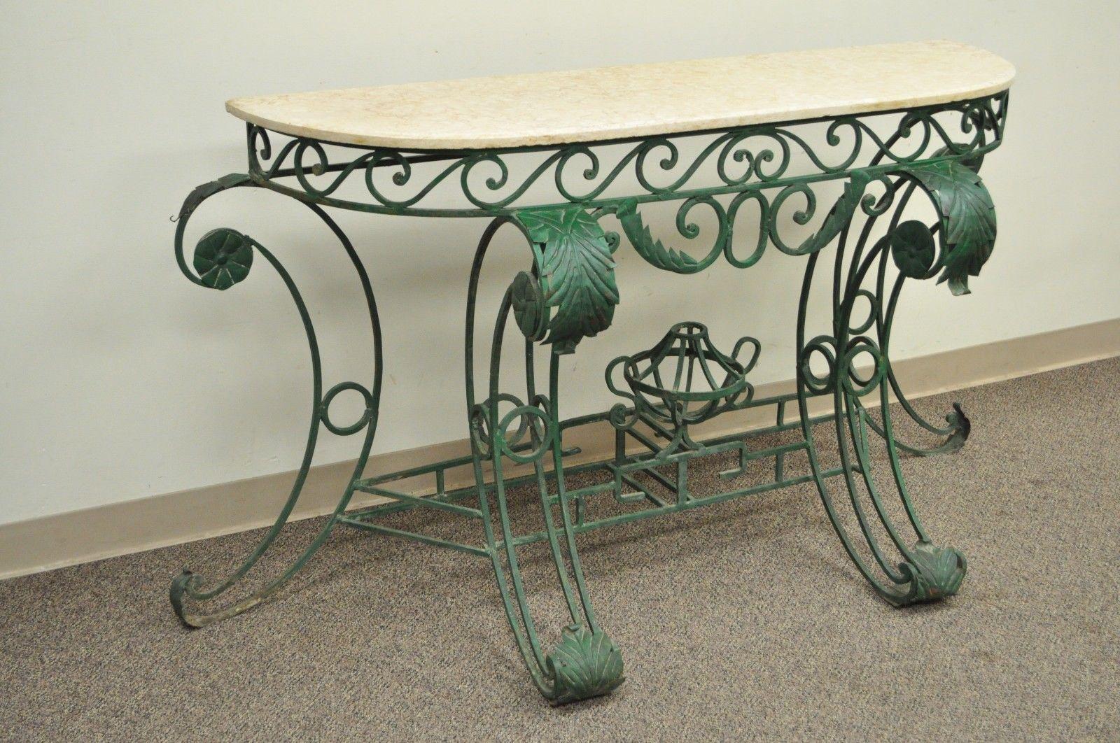 Decorator Italian Regency style iron marble-top console table. Item features scrolling wrought iron frame, urn stretcher, shaped marble top, and green painted finish, circa late 20th century, contemporary. Measurements: 35