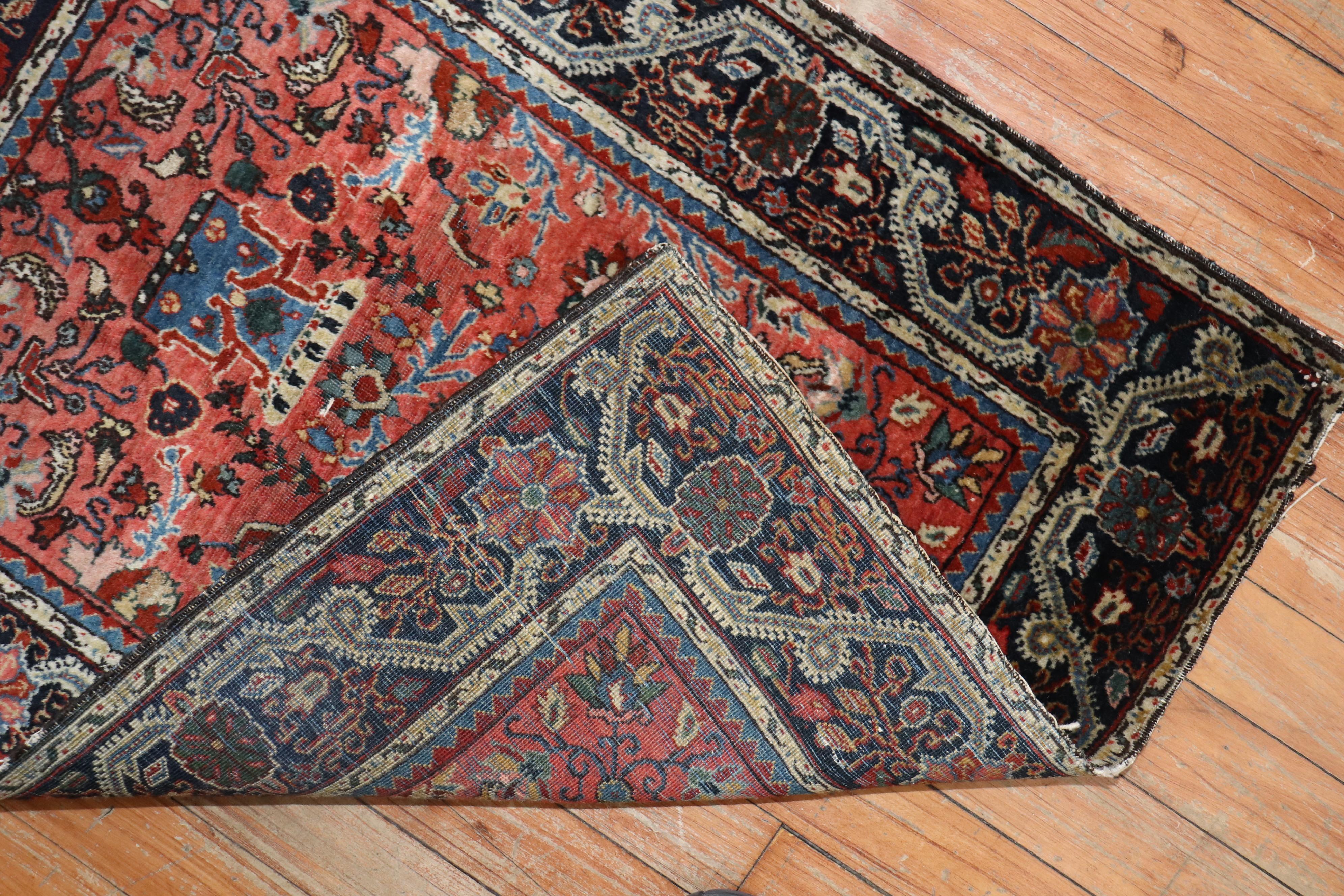 An early 20th century high collectible Jozan Sarouk rug with an ornate palette in rich brick red and navy tones

Measures: 2' x 2'7”.

 