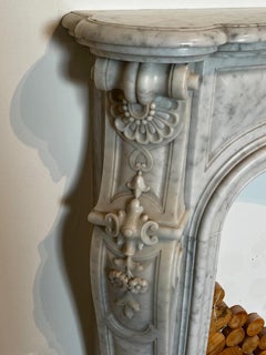 Ornate Louis XV-Style Fireplace Hand-Carved in Carrara Marble
