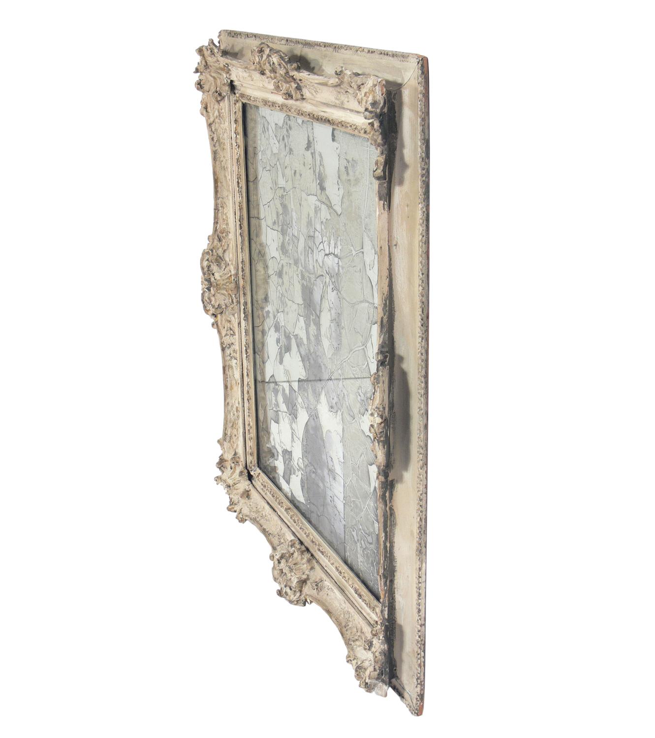Miroir orné avec argenture originale ultra-dégradée, probablement français, vers les années 1930.