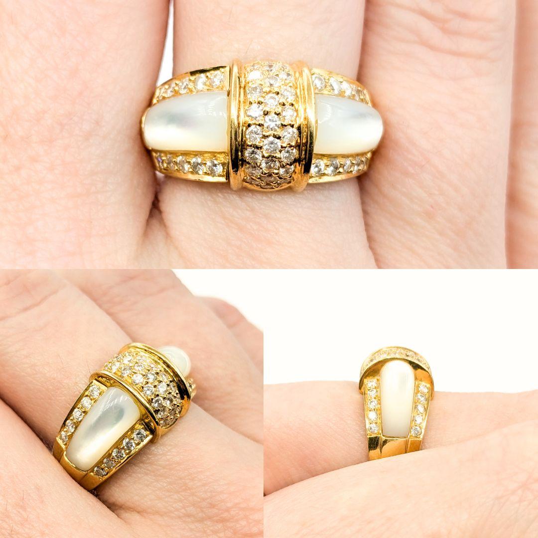 Ornate Mother-of-Pearl & Diamond Band Ring in 18k Yellow Gold

Introducing this beautiful ring, meticulously crafted in 18k yellow gold. The ring features Mother-of-Pearl inlayed with 0.66ctw pave set round diamonds down the sides and center. The