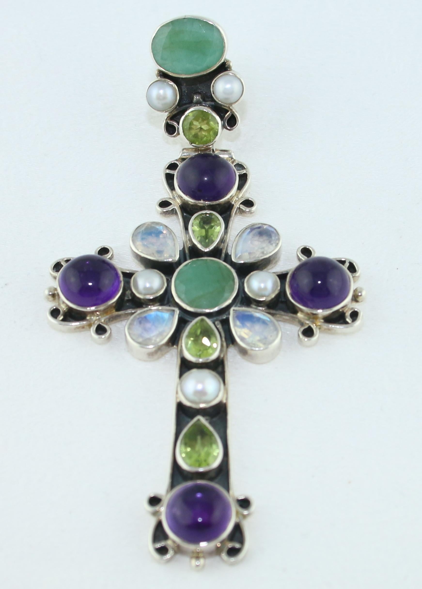 Beautiful Ornate Cross Pendant
The pendant is a Sterling Silver 925
There is Amethyst, Moonstone, Pearl, Peridot, Jade
The Cross measures 3