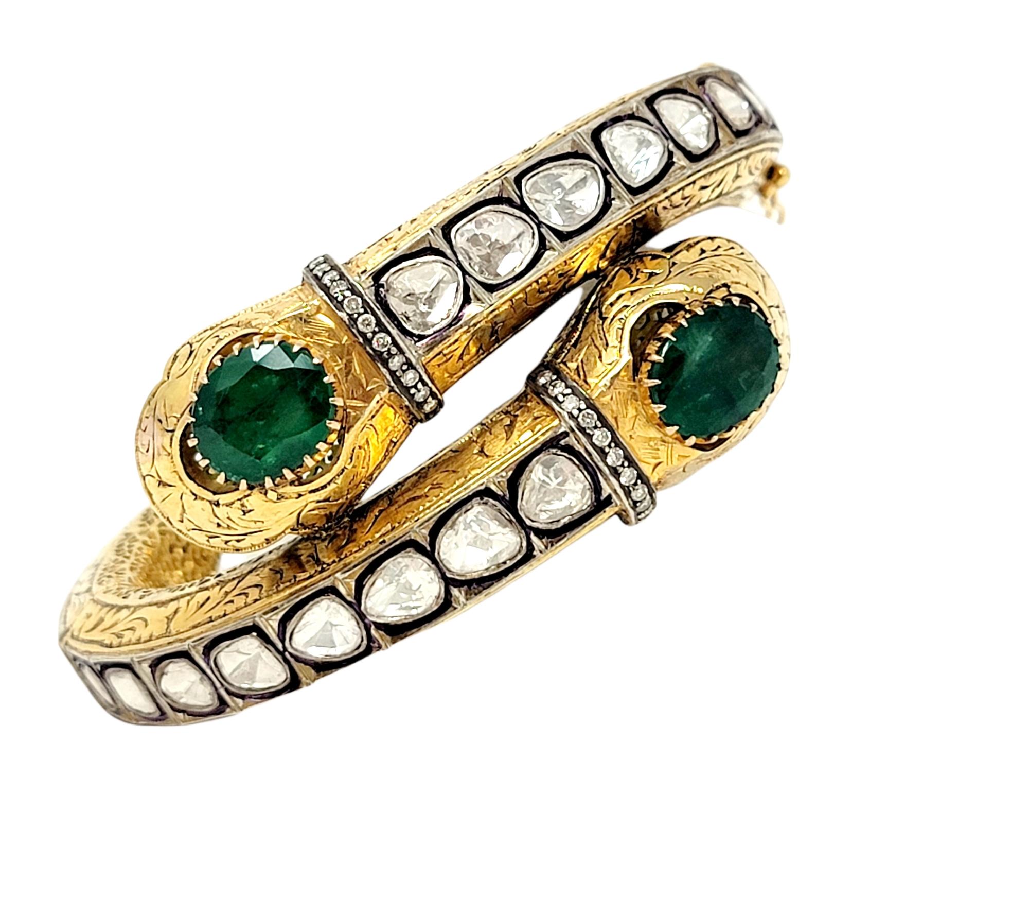 Incredible vintage Polki emerald and diamond bypass bracelet is an absolute work of art for your wrist! This stunning bangle features a 14 karat yellow gold and sterling bodice embellished with rounded rough cut diamonds and large green emeralds