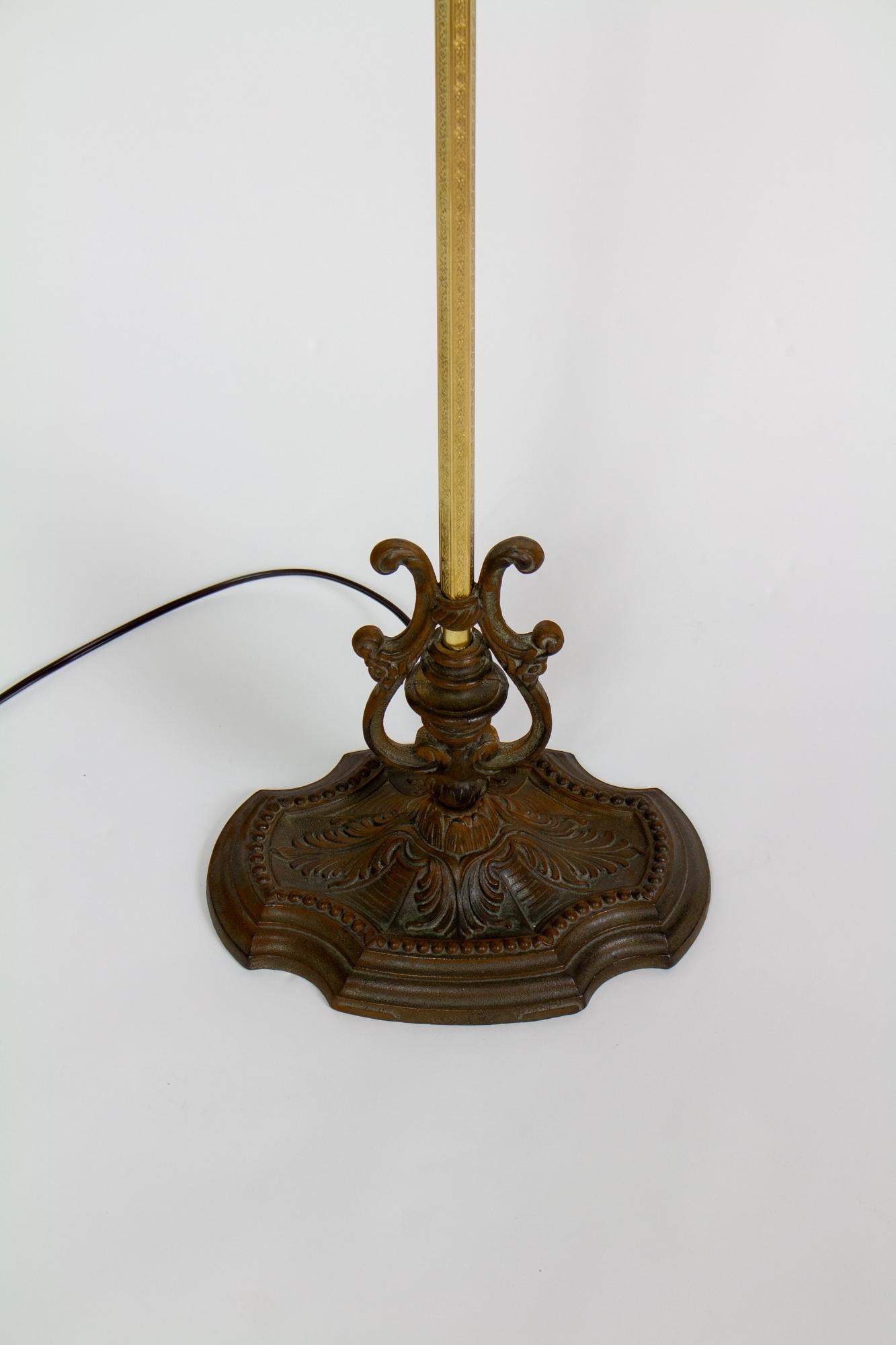 Ornate Bridge lamp, Mix of brass and cast iron. Brass and Bronze color. Custom handsewn shade, in an off white silk, rouched and loosely ruffled.  Shade dimensions are 7