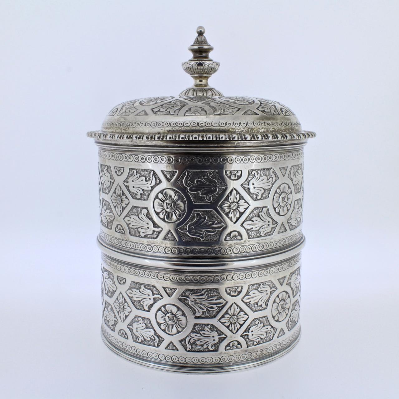 A wonderfully detailed Portuguese covered dresser jar (or humidor) in solid silver by Sarmento, the renowned Portuguese jewelers and silversmiths.

A domed and gadrooned lid covers the two-sectioned body of this jar. Both cover and jar have