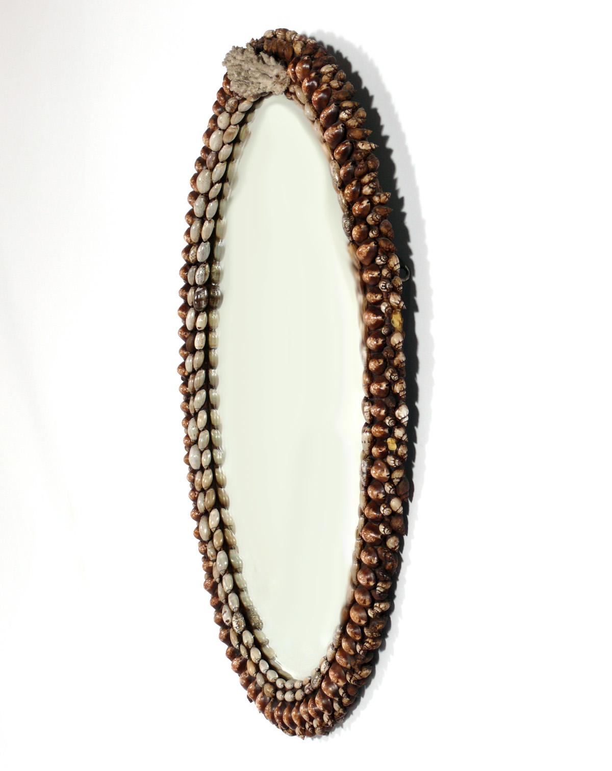 Ornate Seashell Mirror, American, circa 1950s. It measures 33