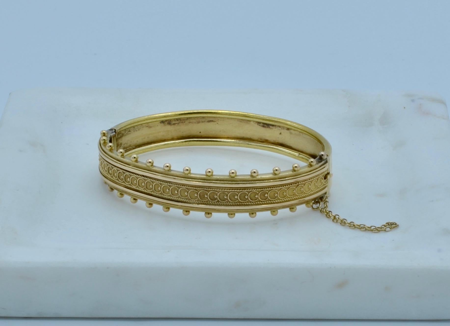 This lovely bracelet is intricately detailed with a lace pattern that extends out in tiny uniformly spaced balls. It gives the bracelet an illusion of dept and three dimension as the back is smooth gold.It is a unique and comfortable bracelet you
