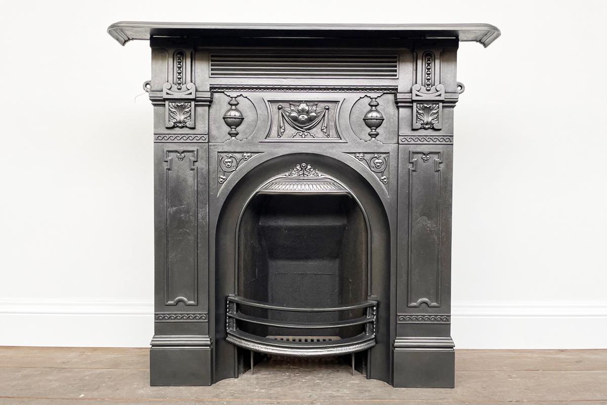 An ornate Victorian cast iron combination fireplace of good proportions, dated 1888.

Finished with traditional black grate polish and complete with a new clay fire back and cast iron bottom grate.

For detailed size please see the size diagram in