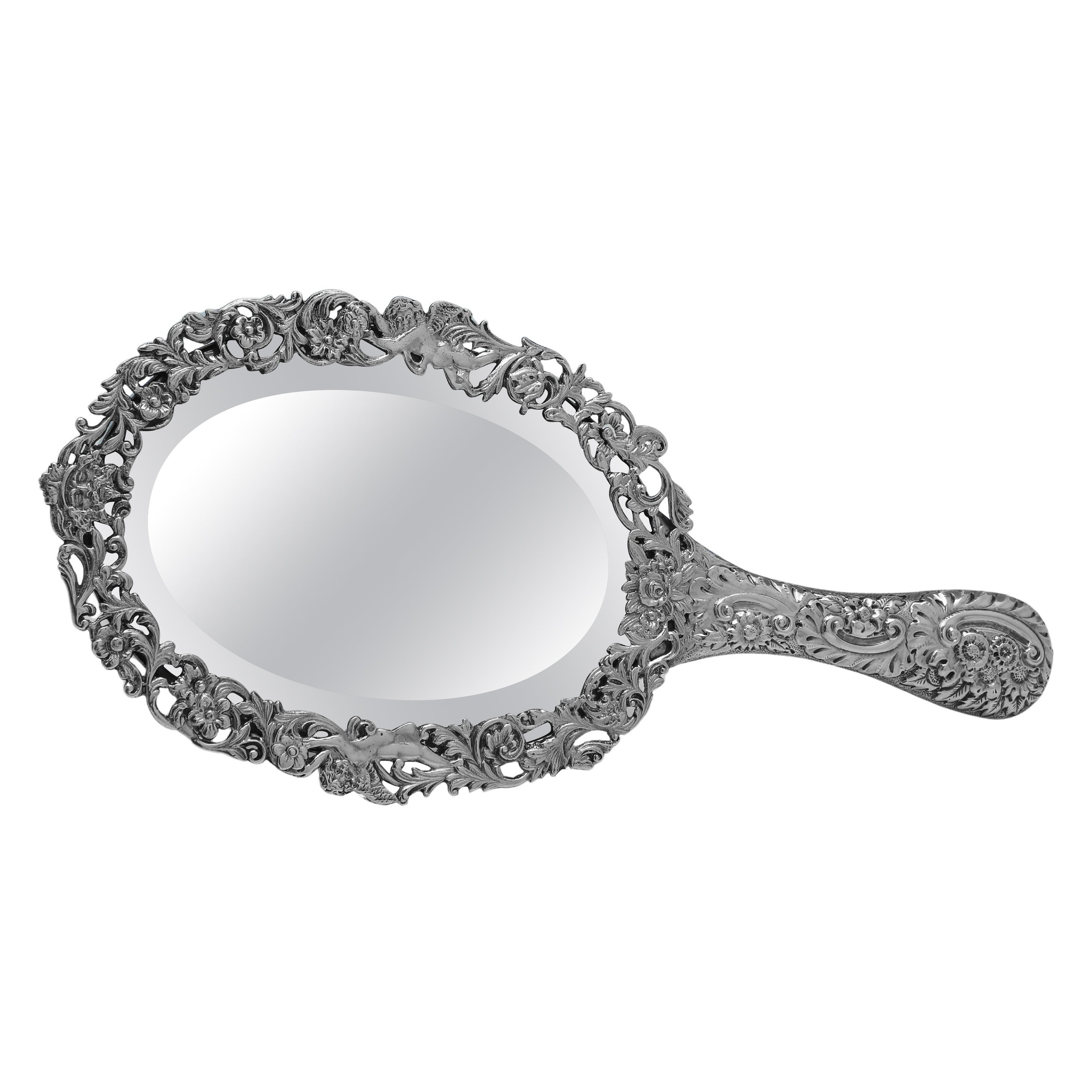 Ornate Victorian sterling silver hand mirror made in 1890