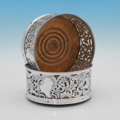 Ornate Victorian sterling silver wine coasters made by George Fox in London 1890