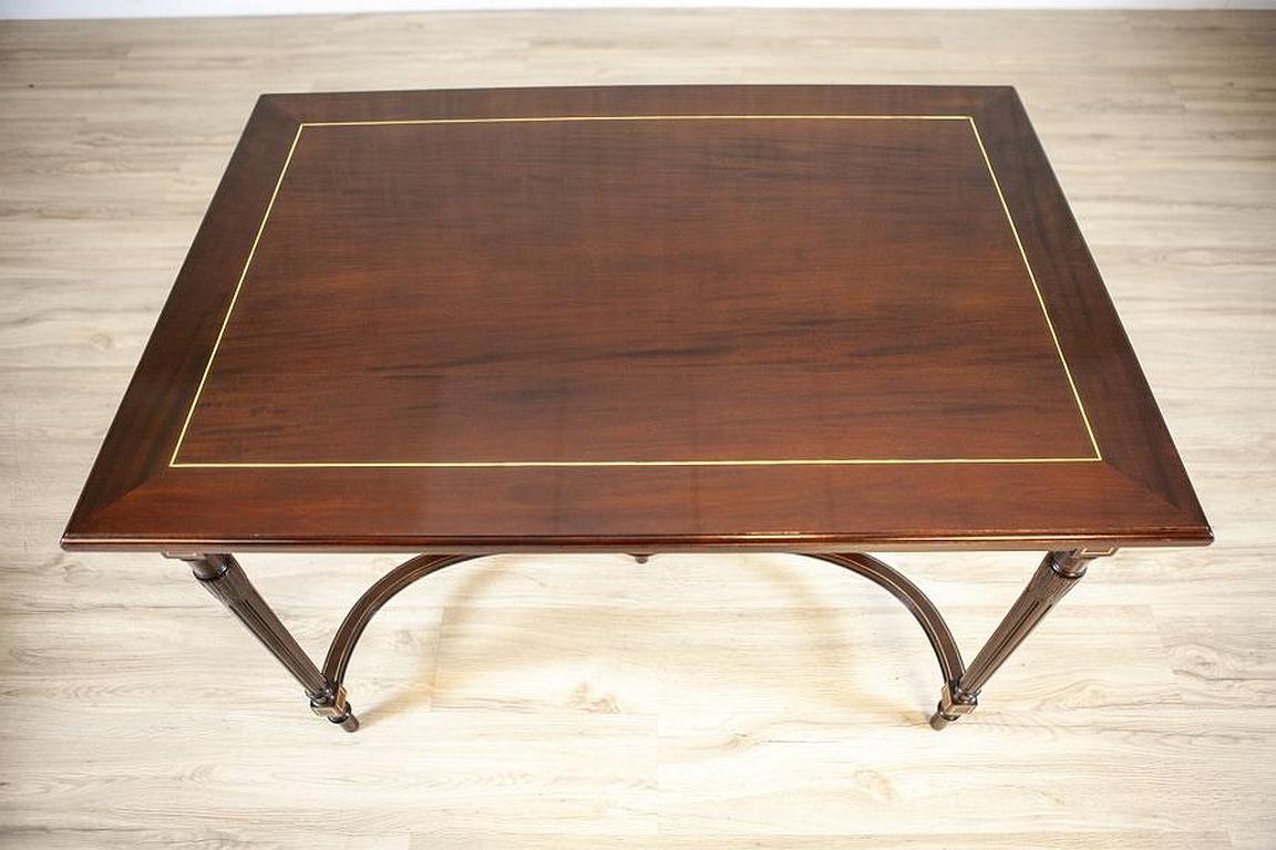 Ornate Walnut Dining Table From the Mid. 20th Century in the English Style

We present you this dining table, decorated with a metal vein, from the mid. 20th century in the English style.
The set was manufactured in Nederland Manufactory of J. A.