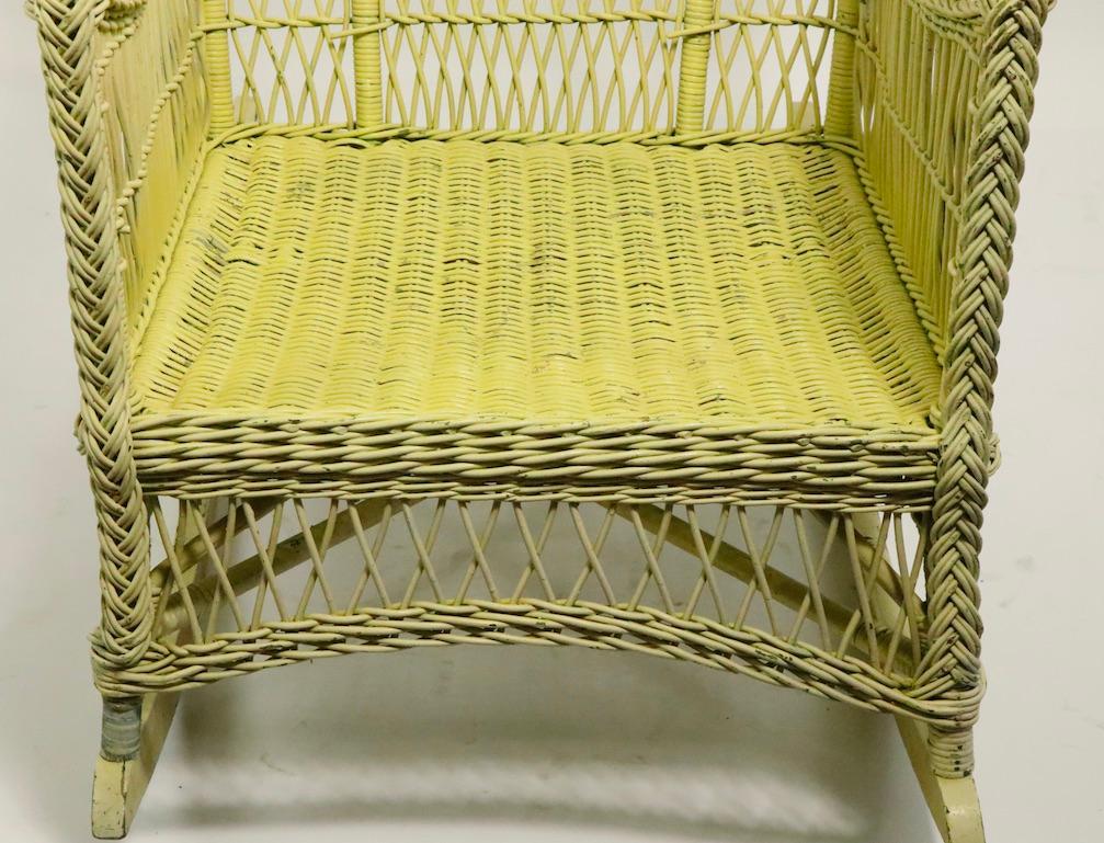 Ornate Wicker Rocking Chair Attributed to Heywood Brothers Company In Good Condition In New York, NY
