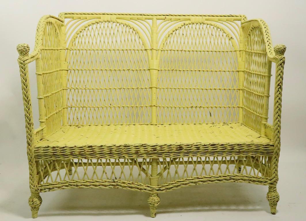 Ornate Wicker Settee Loveseat Sofa Attributed to Heywood Brothers Company In Good Condition In New York, NY