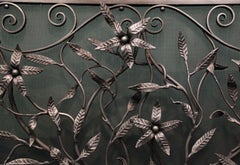 Ornate Wrought Fire Screen with Scrollwork and Wild Flowers