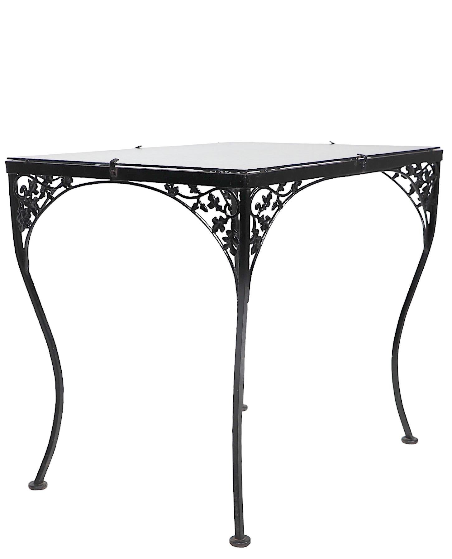 Ornate Wrought Iron and Glass Garden Patio Poolside Dining Table att. to Woodard In Good Condition For Sale In New York, NY