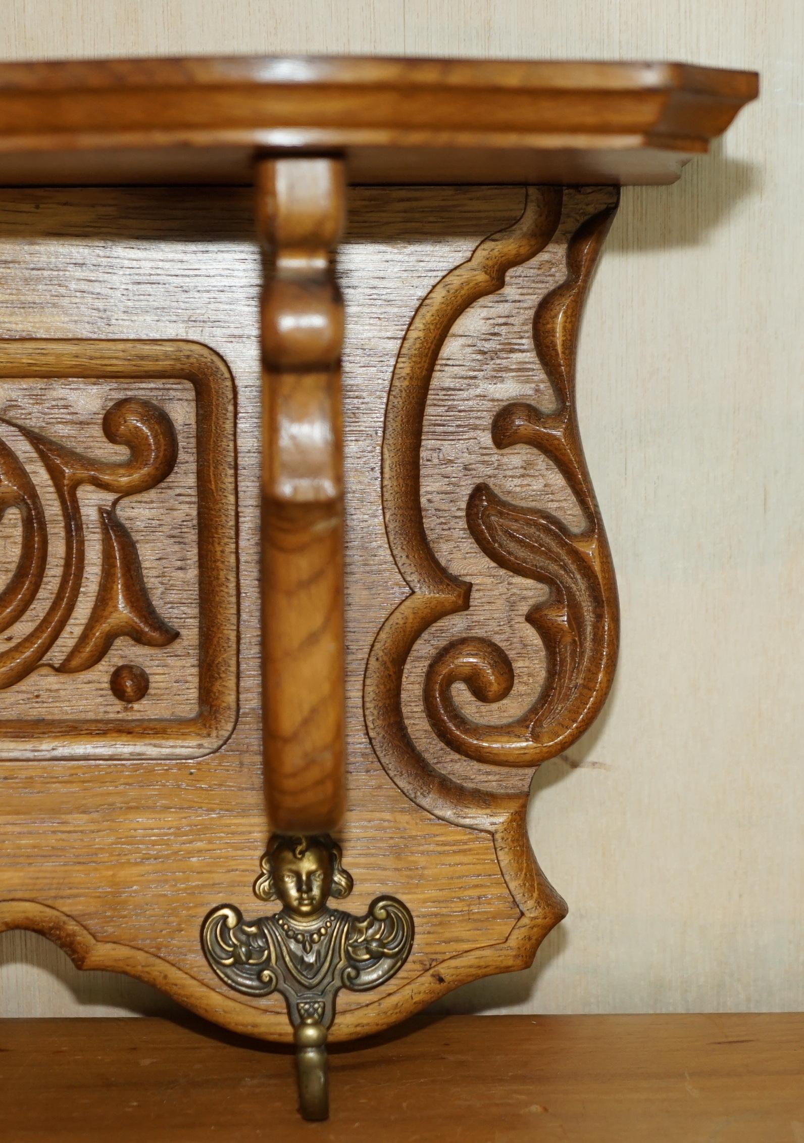 20th Century Ornately Carved Cherub Dutch Oak Coat Hat Scarf Wall Rack Hanger Royal Hooks For Sale
