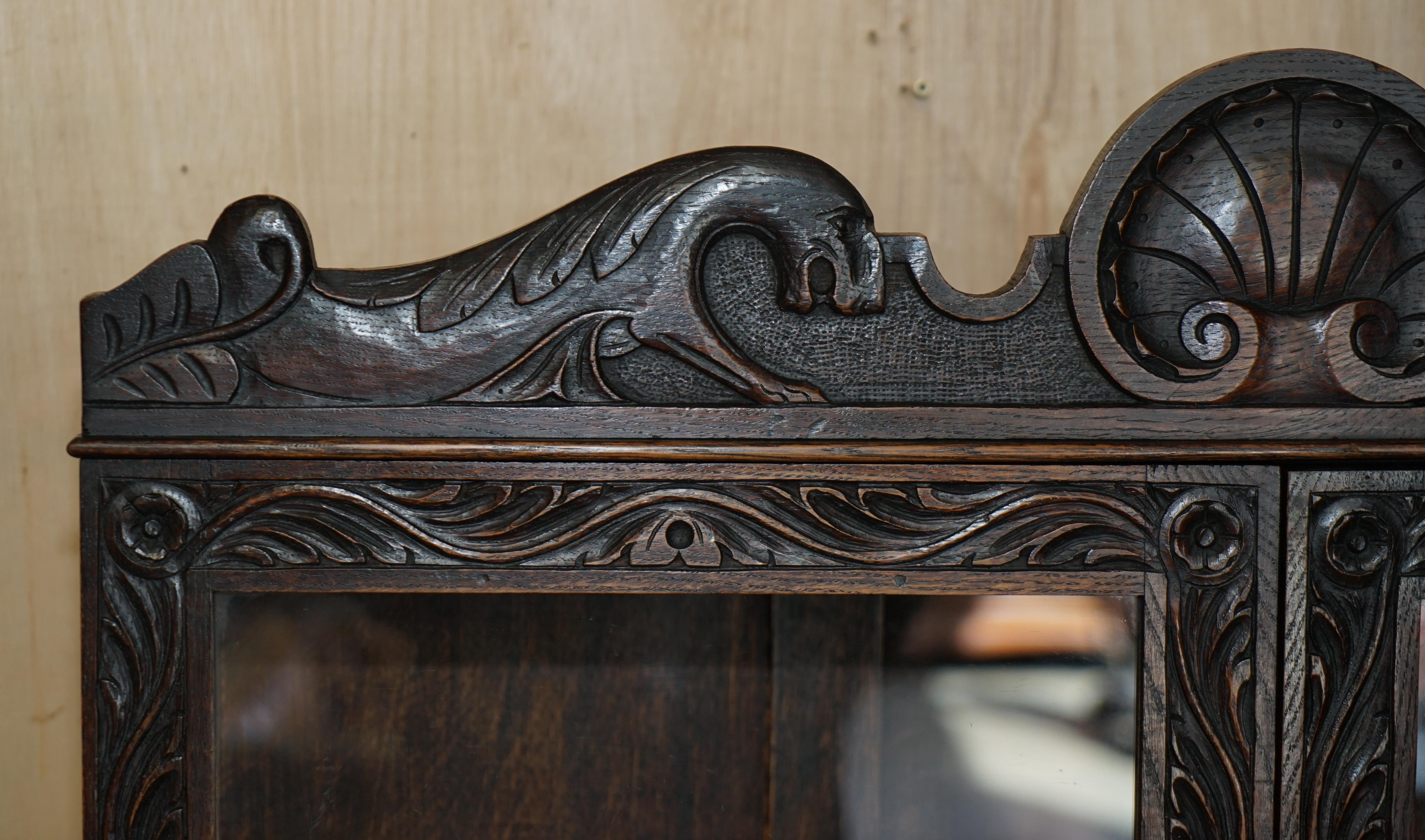 Jacobéen ORNATELY CARVED ENGLISH OAK LIBRARY BUREAU BOOKCASE LION'S HEAD BRASS HANDLES en vente