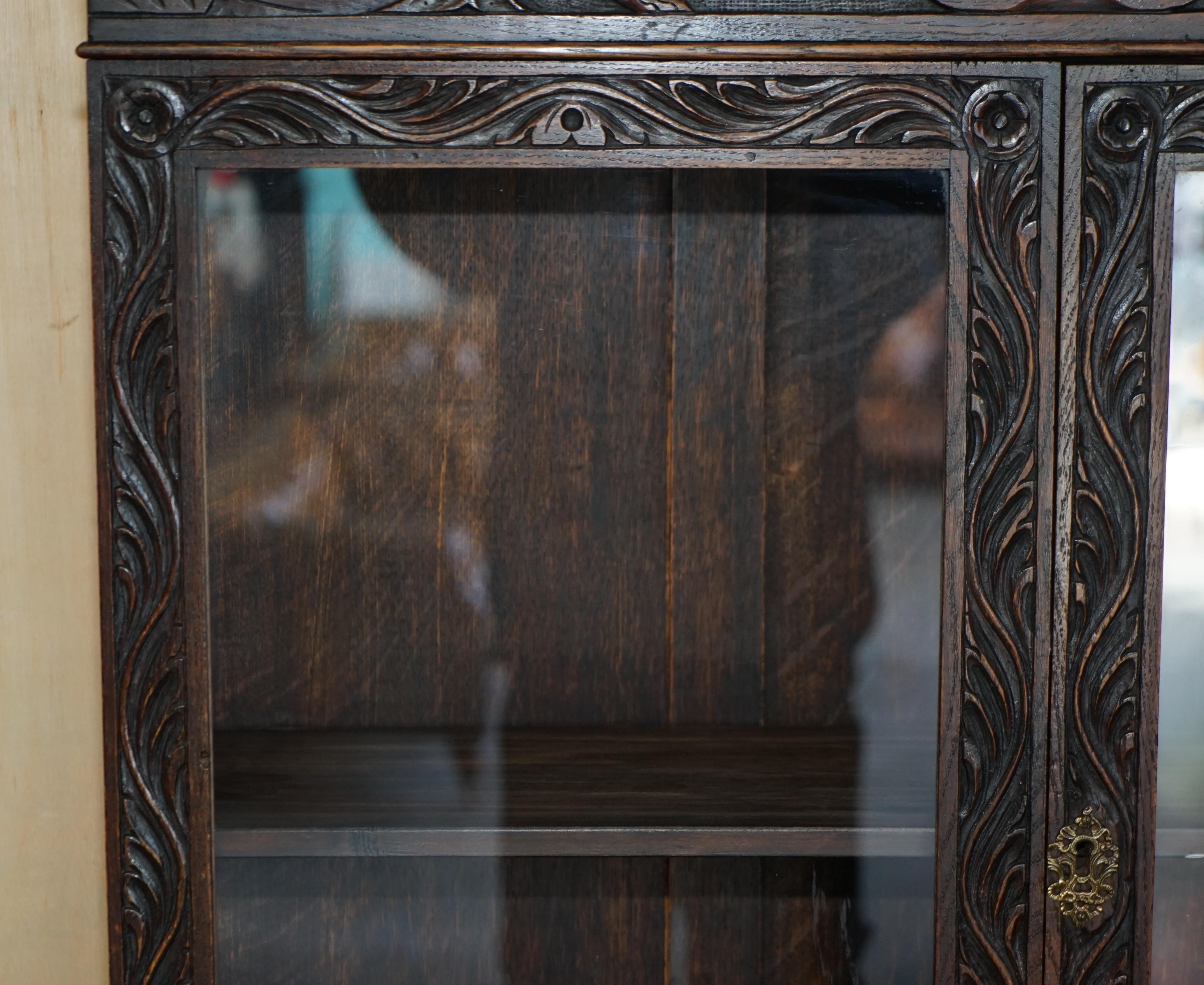 Mid-19th Century Ornately Carved English Oak Library Bureau Bookcase Lion's Head Brass Handles For Sale