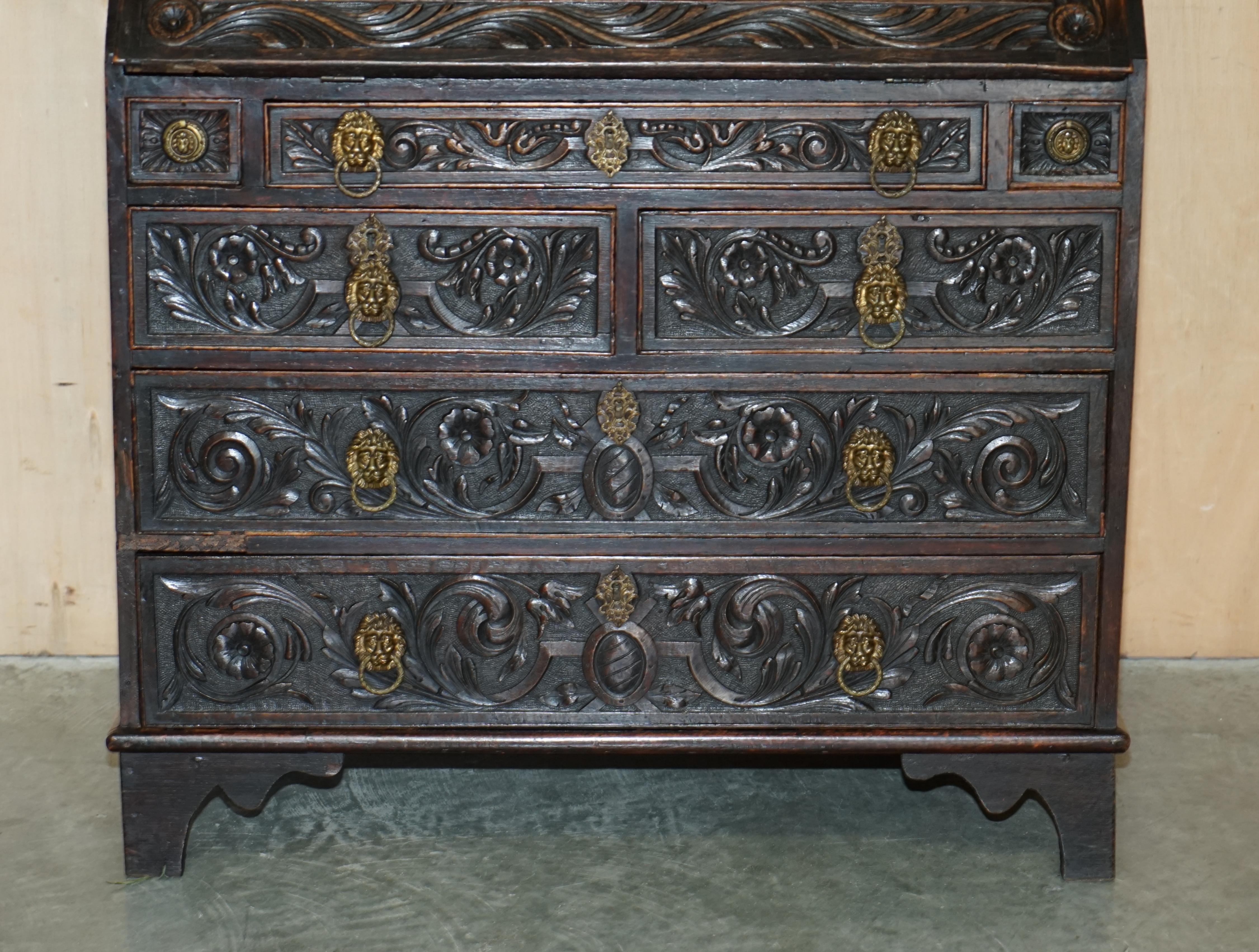 ORNATELY CARVED ENGLISH OAK LIBRARY BUREAU BOOKCASE LION'S HEAD BRASS HANDLES en vente 1